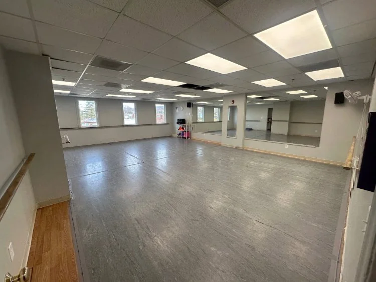 Dance.tech Studio B in Blacksburg featuring mirrors, barres, and a sprung dance floor ready for classes.