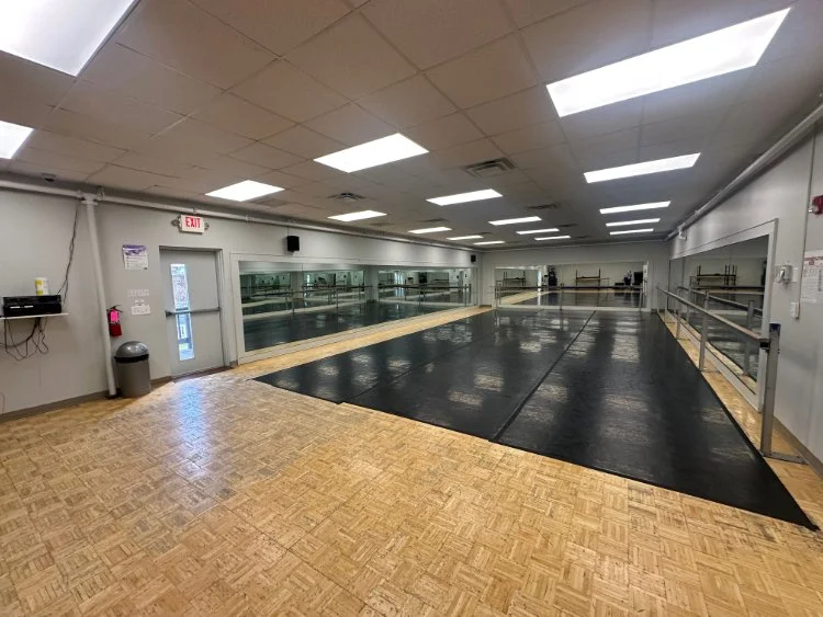 Dance.tech Studio A in Blacksburg featuring mirrors, barres, and a professional dance floor ready for classes.