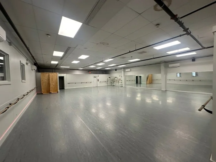 Dance.tech Dance Studio B+ in Blacksburg featuring mirrors, barres, and a spacious professional dance floor.