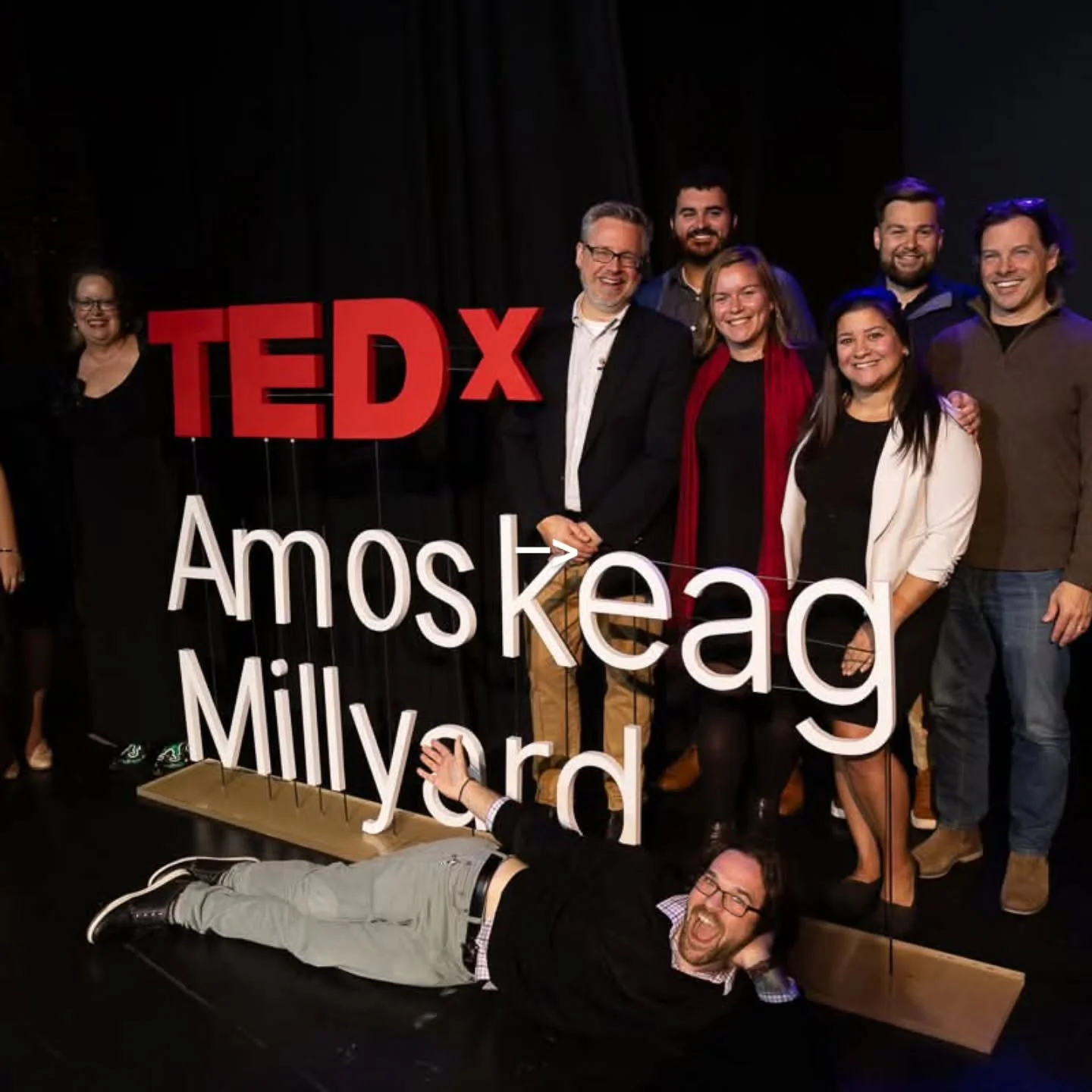 🎤 Meet the Team: Dave Hudson
Dave Hudson (seen here, standing closest to our letter ❌️) has been part of the #TEDxAM family since 2013! Over the past 10+ years, he’s been an organizer, speaker coach, and host — TEDxAmoskeagMillyard sim