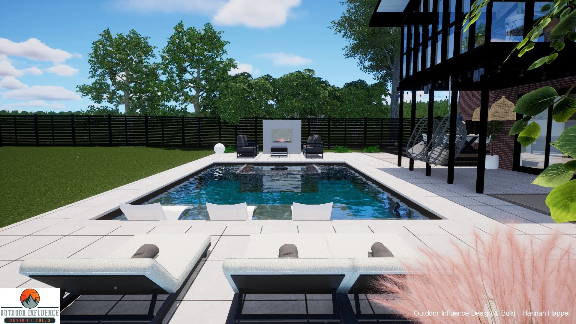 Modern outdoor pool area with loungers and a fireplace, surrounded by trees and a black fence, adjacent to a building with large windows and hanging chairs.
