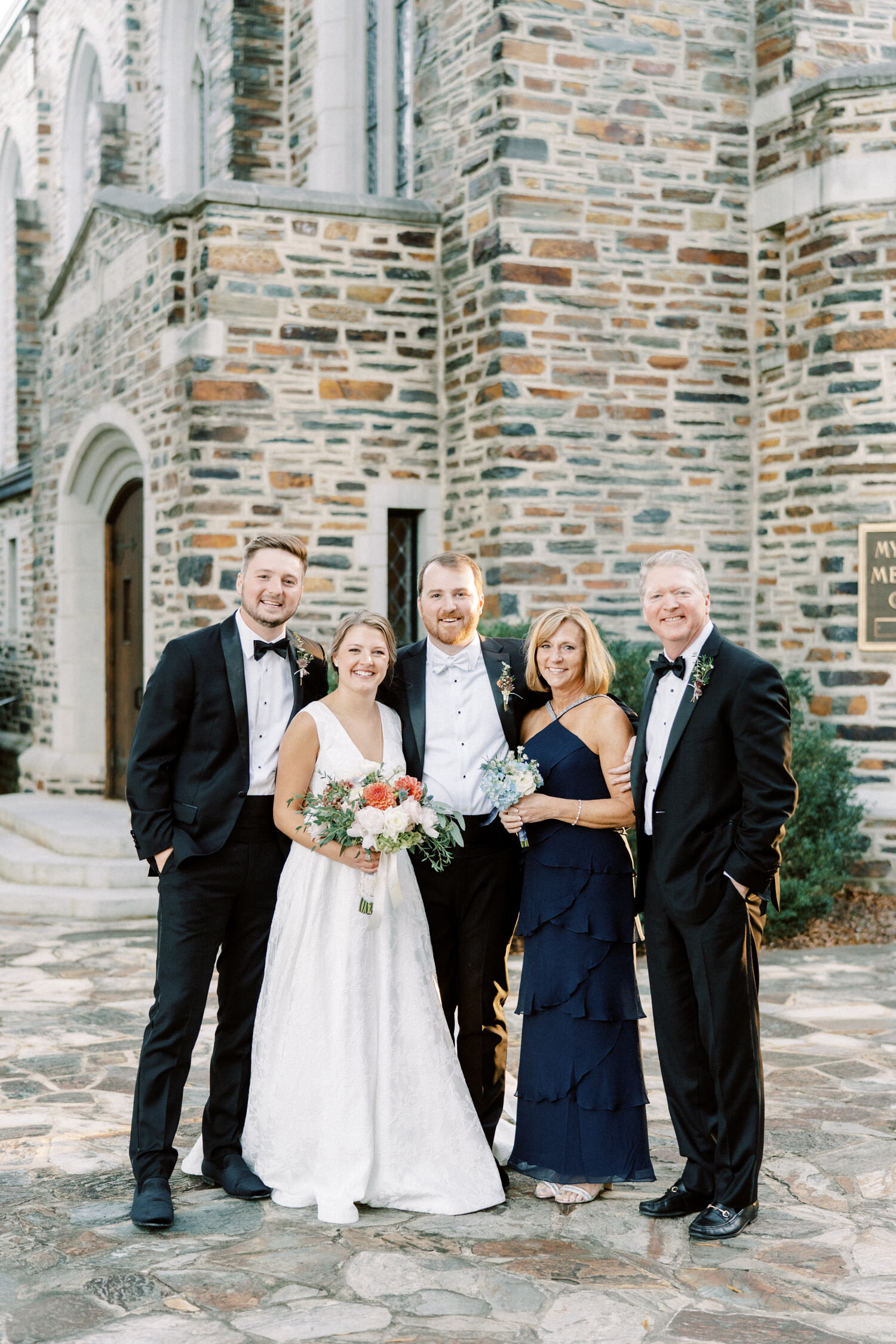 a formal photo of the bride and her family