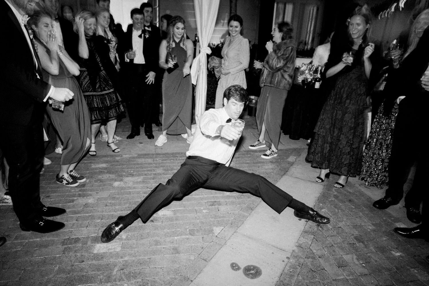 a groomsman dances during wedding reception