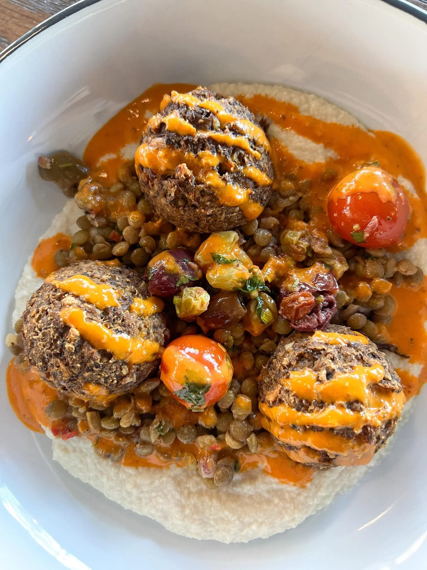 NOW SERVING: MEDITERRANEAN BOWL with our housemade shroom meatballs, cauliflower tahini pur&eacute;e, lentil salad, tomato olive raisin chutney, and harissa vinaigrette 🤩