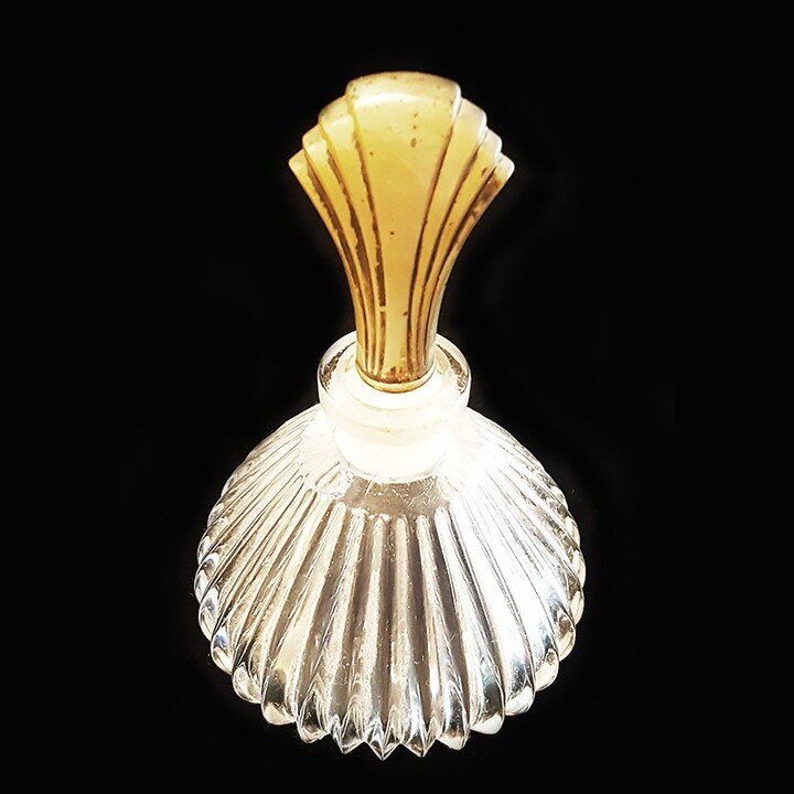 Beautiful vintage perfume bottle. Stopper gold plate on sterling silver. The glass is ribbed and is in good condition. It is about 5&quot; tall and represents an elegant reminder of bygone eras where bottles served as luxury artifacts. 

#sterlingsil