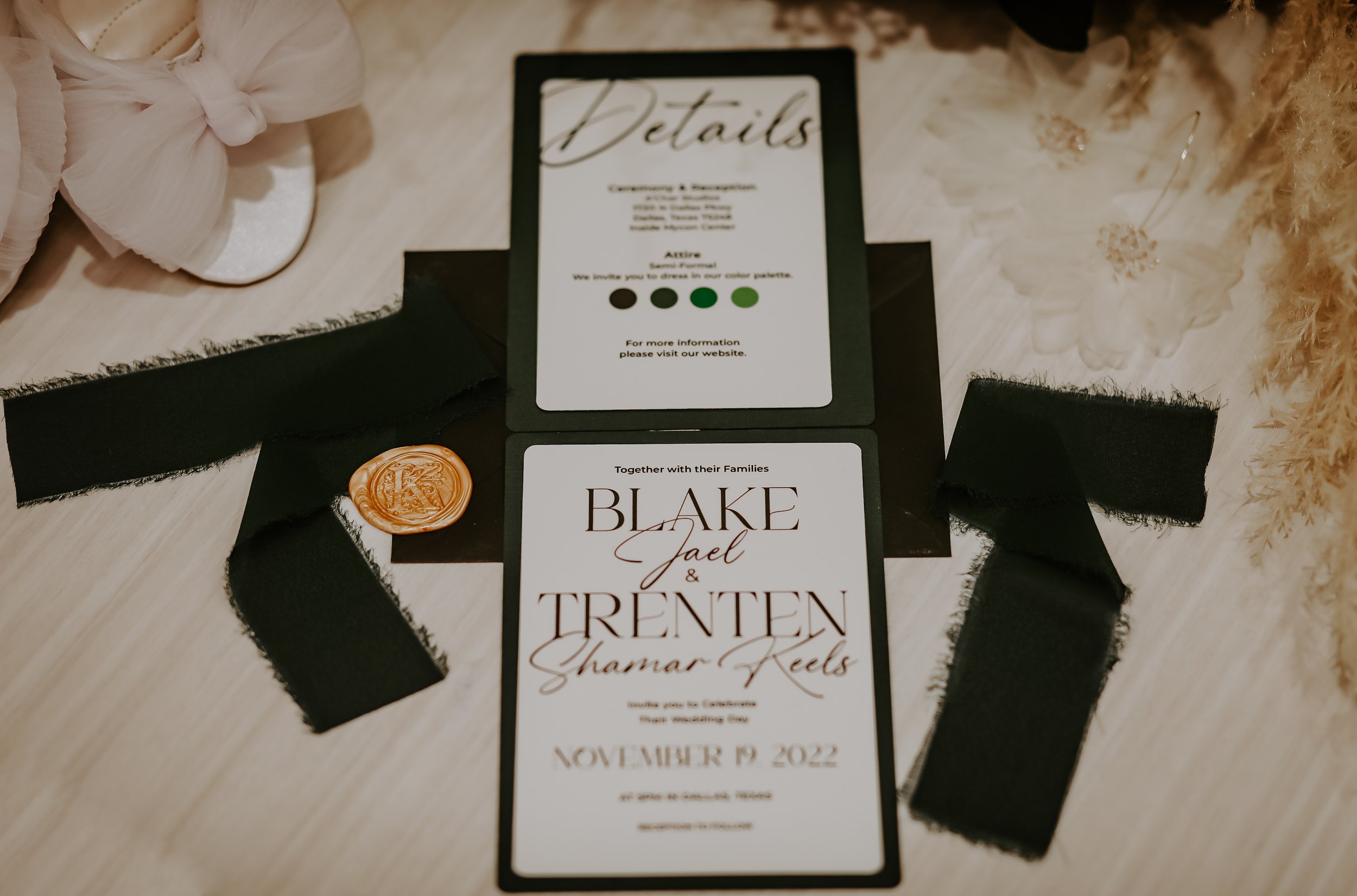 wedding invitations surrounded by ribbon and heels