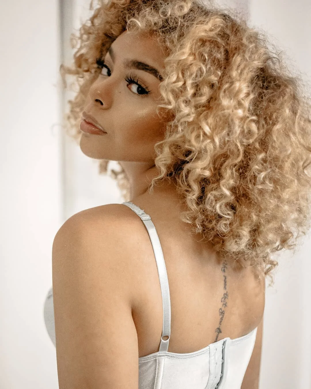 woman looking over shoulder at camera