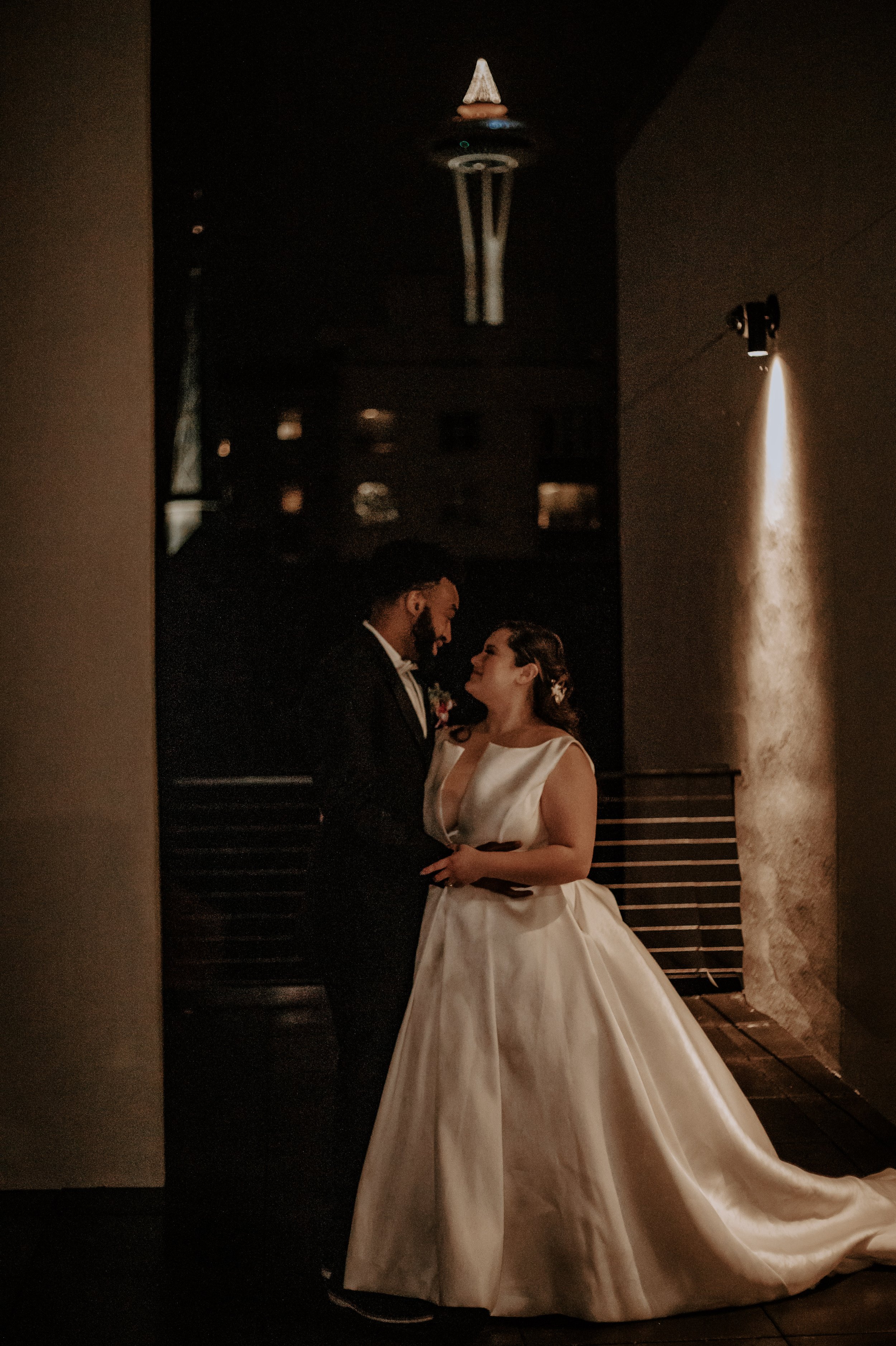 couple looking at each other on rooftop 