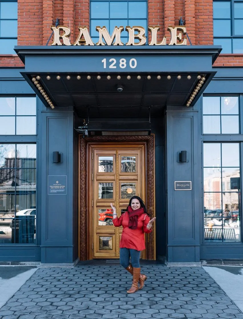 Jovina in front of the Rable Hotel entrance in Denver, CO