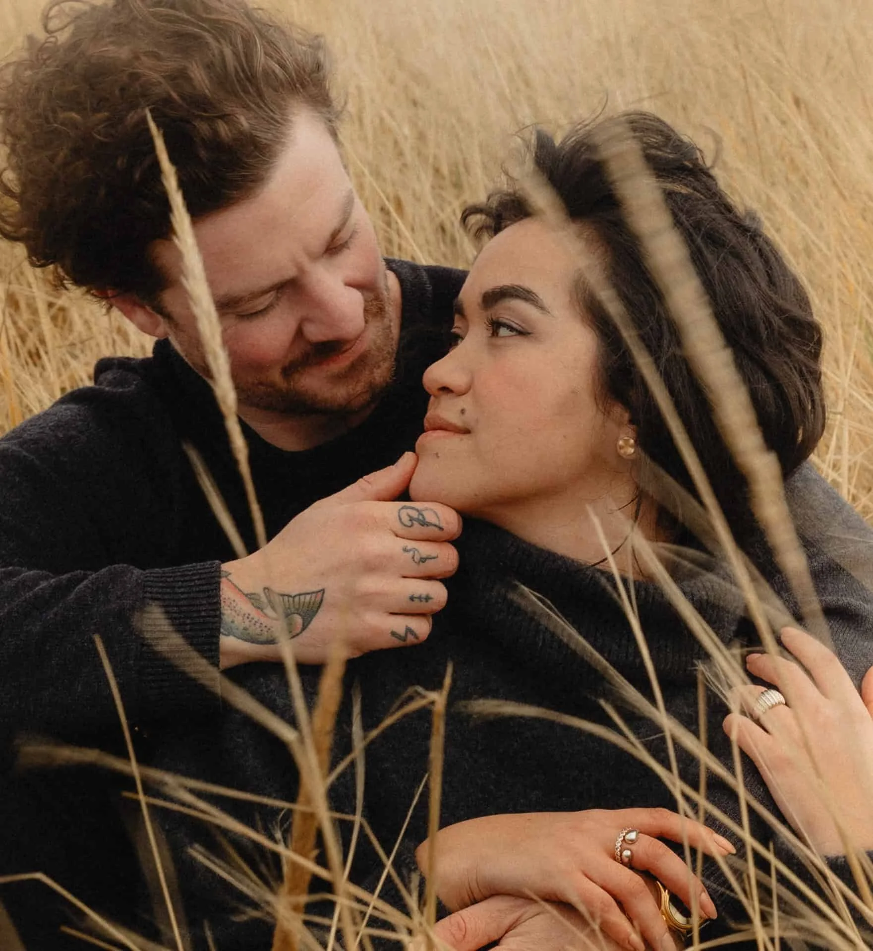 Couple sitting at Oregon Coast Engagement Photos