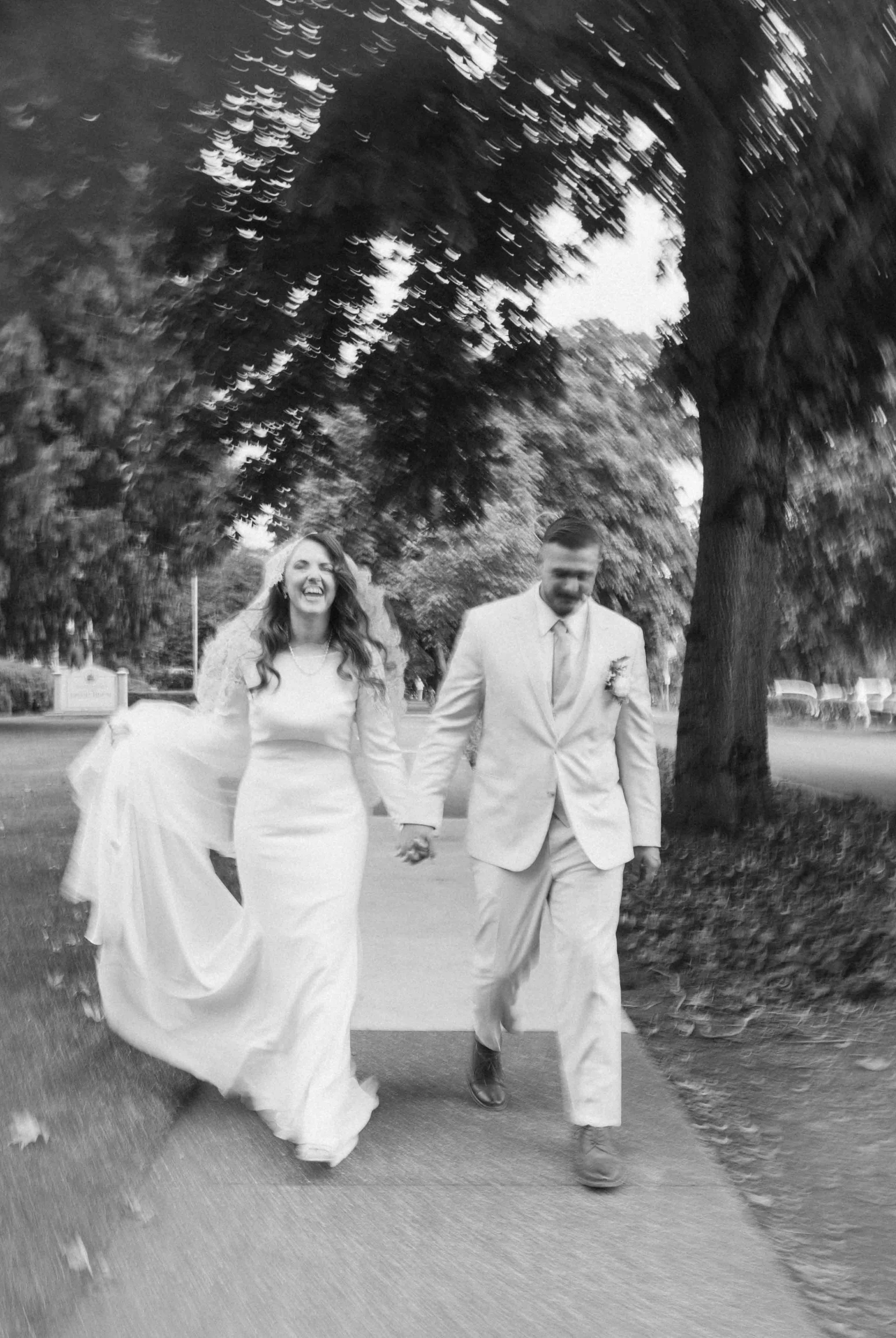 Black and white photos of newlyweds walking through downtown Vancouver, WA after their wedding ceremony