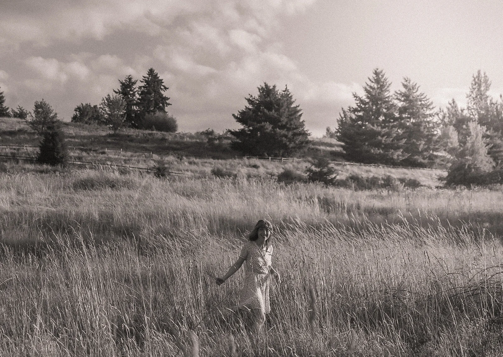 Women running through a field during an adventure photography session
