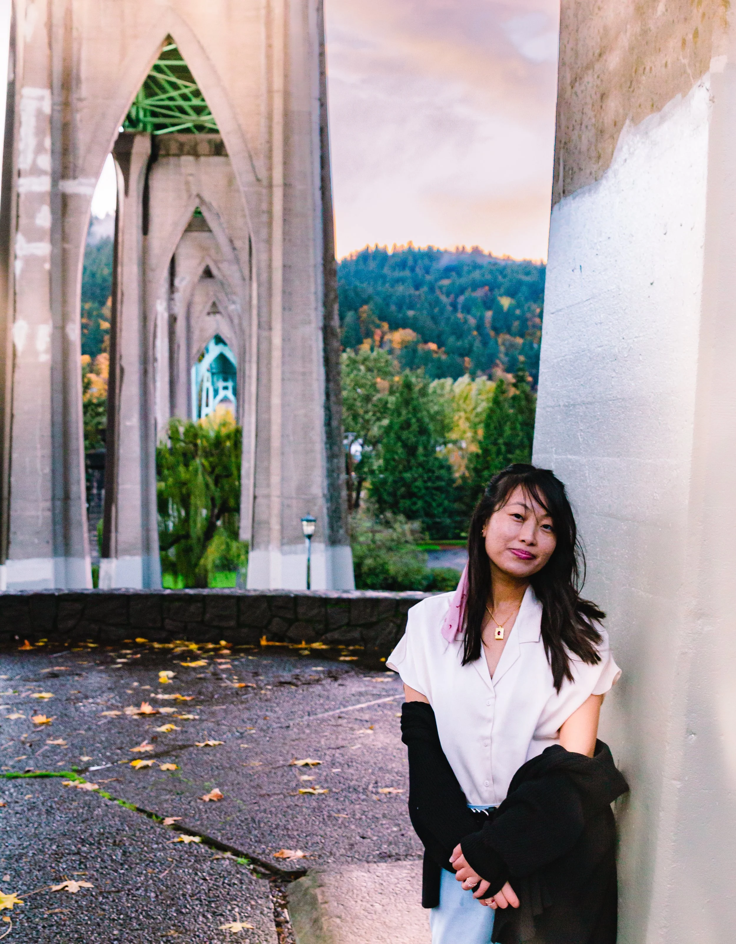 Women posing under a bridge during a portrait photography session in Portland, Oregon