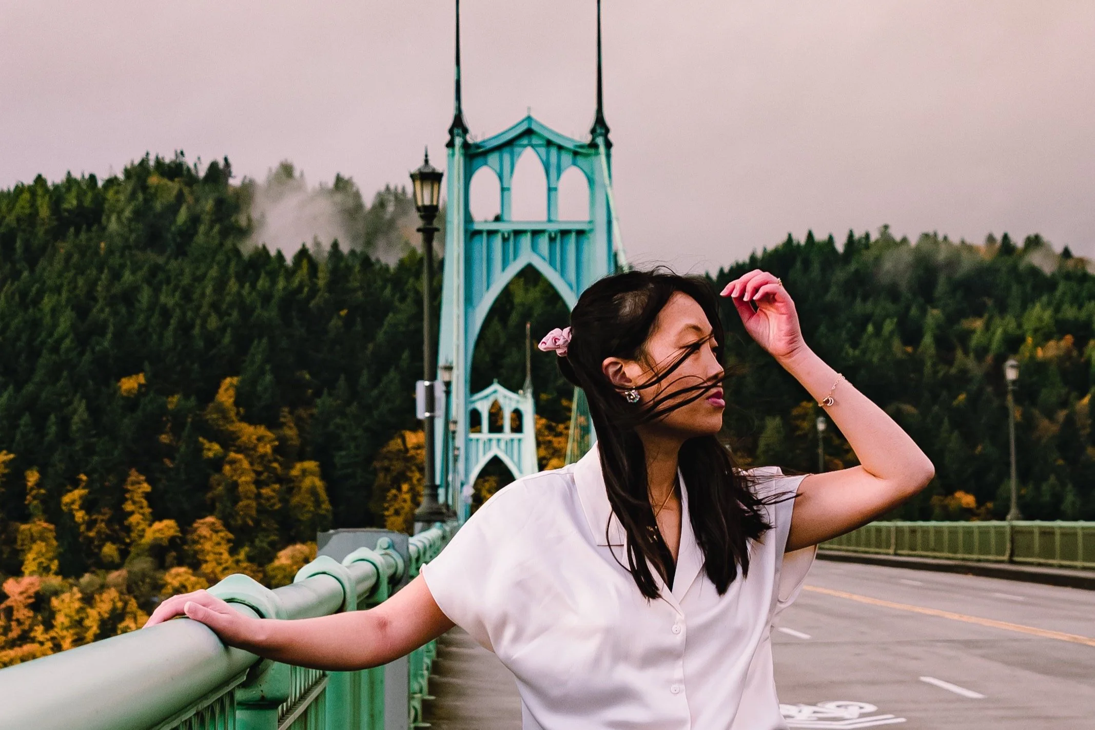 Women standing on a bridge during a portrait photography session in Portland, Oregon by Abigail Janelle Photography