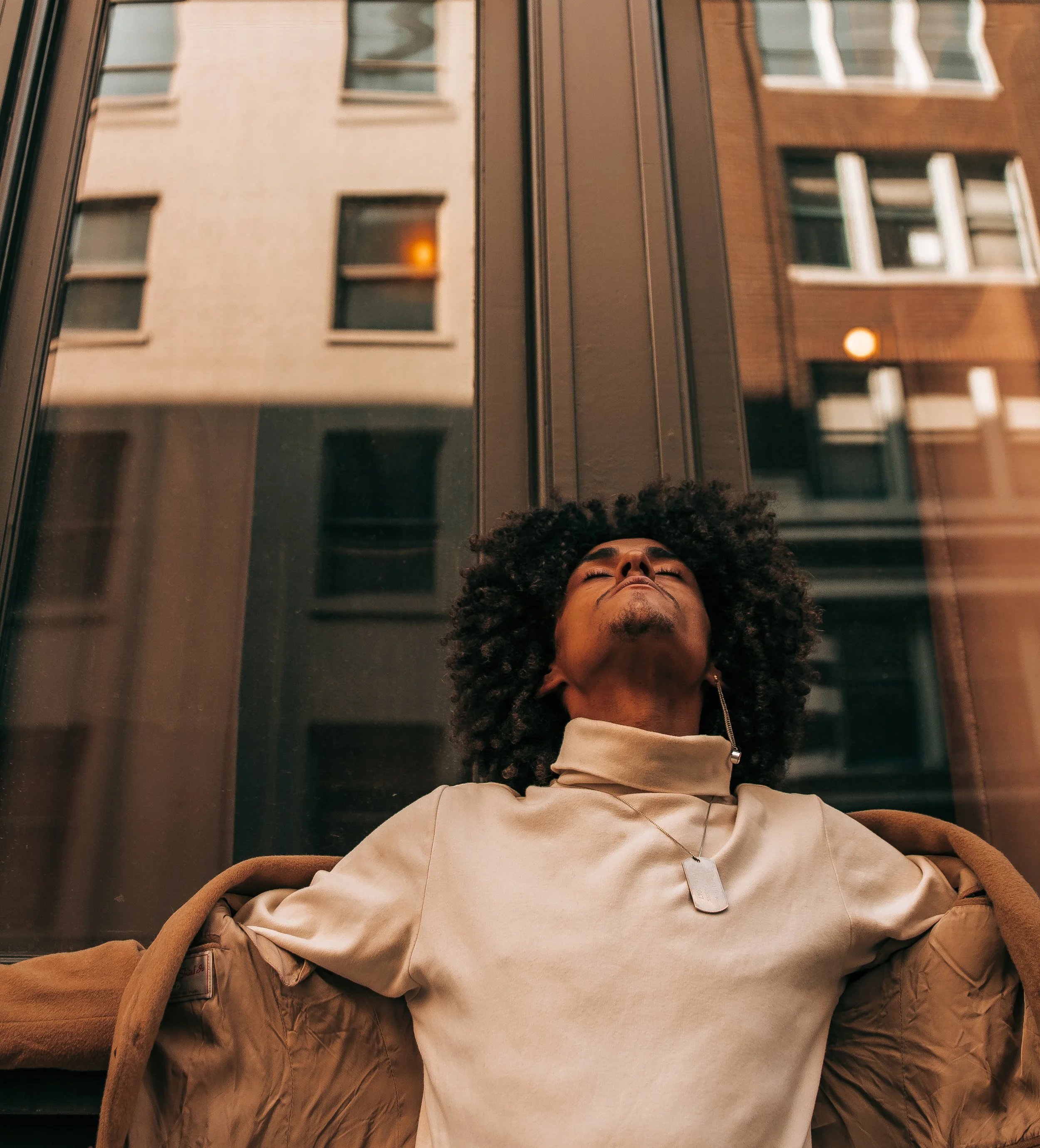 Man leaning against a wall in downtown Portland, OR by Photographer Abigail Janelle