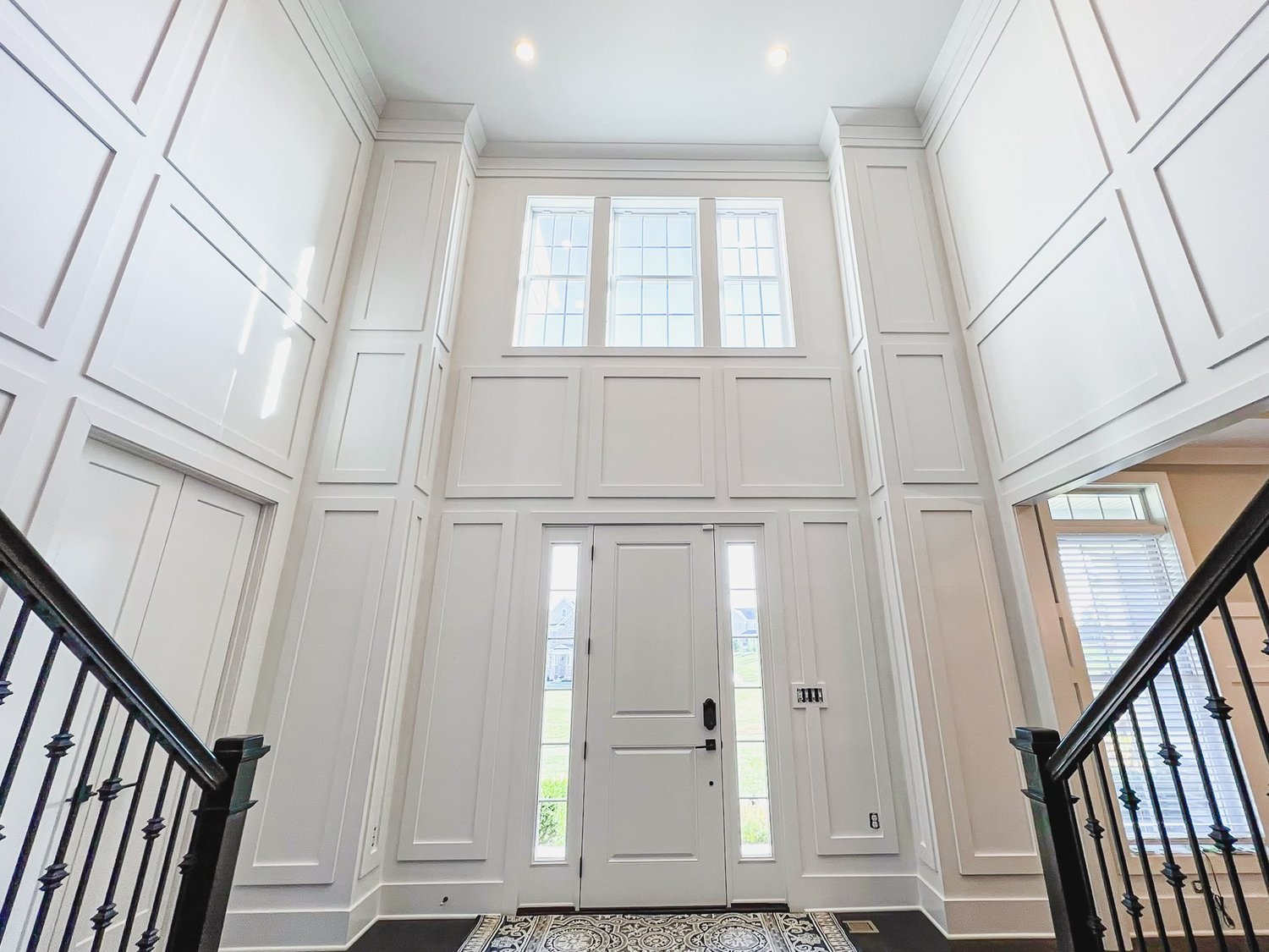 Foyer wall with shadow box trim and crown molding