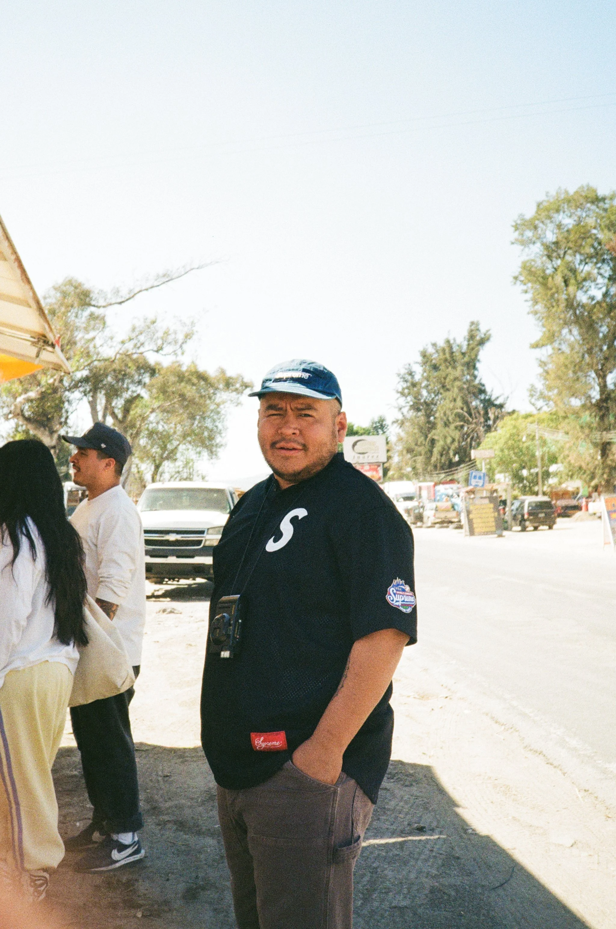 Milton on the side of the road while we order aqua de coco.