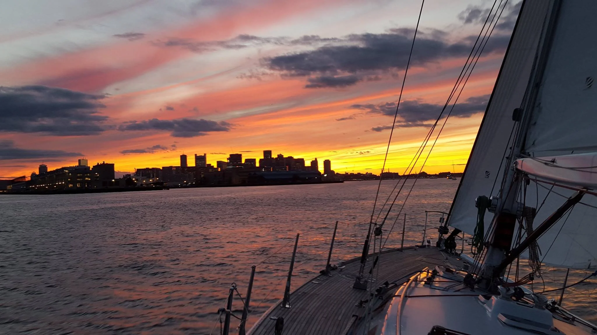 Sunset over Boston skyline from the harbor