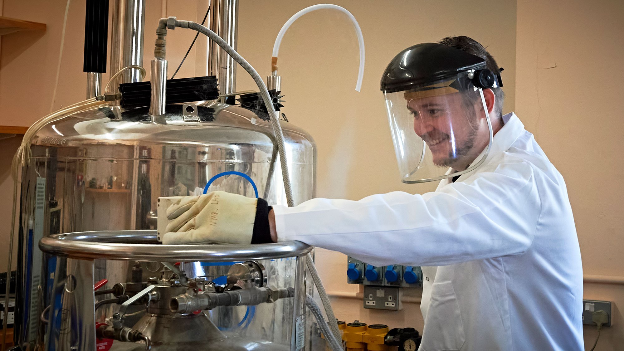 Male PhD student in the lab