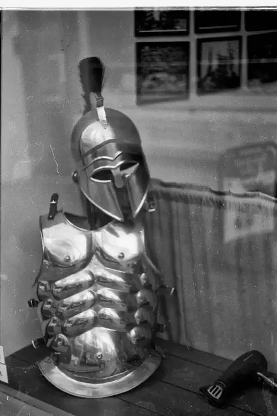 Street Photography, a suit of armour in a second hand store in Okehampton, Devon. Shot on film and home developed and scanned.