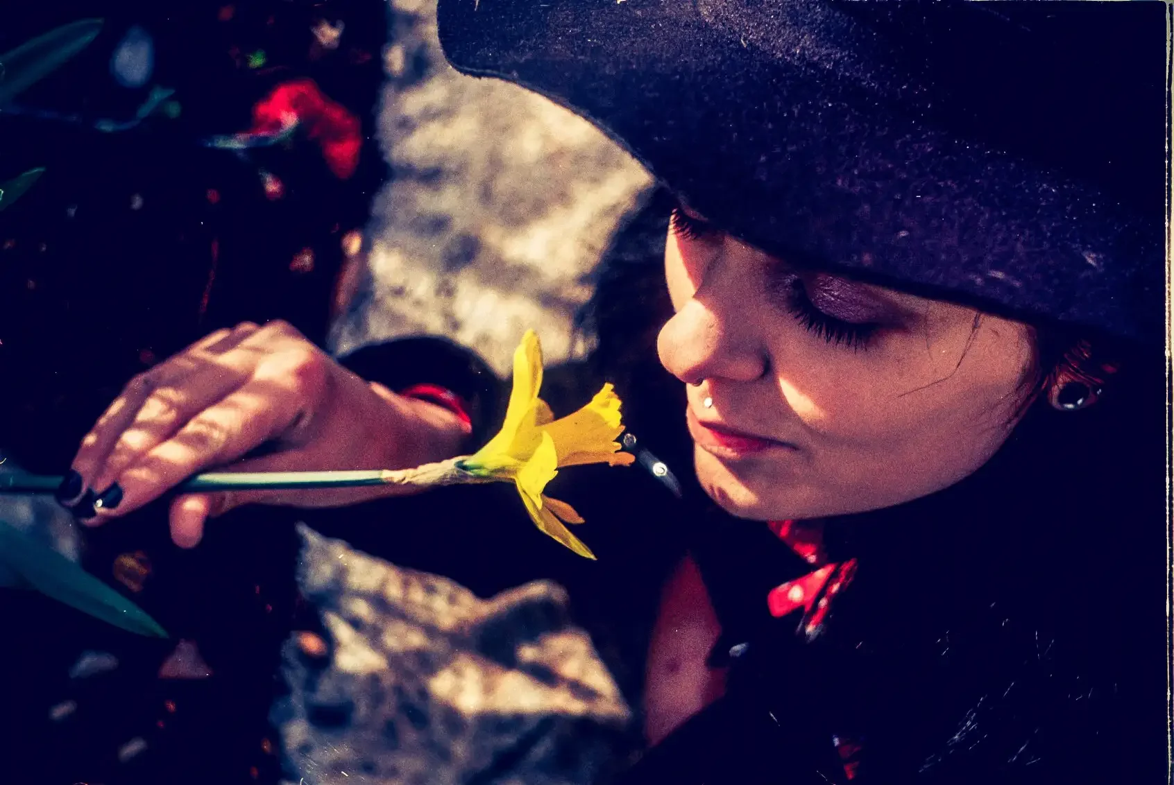 Lisa with a daffodil, shot on colour film in Plymouth, Devon