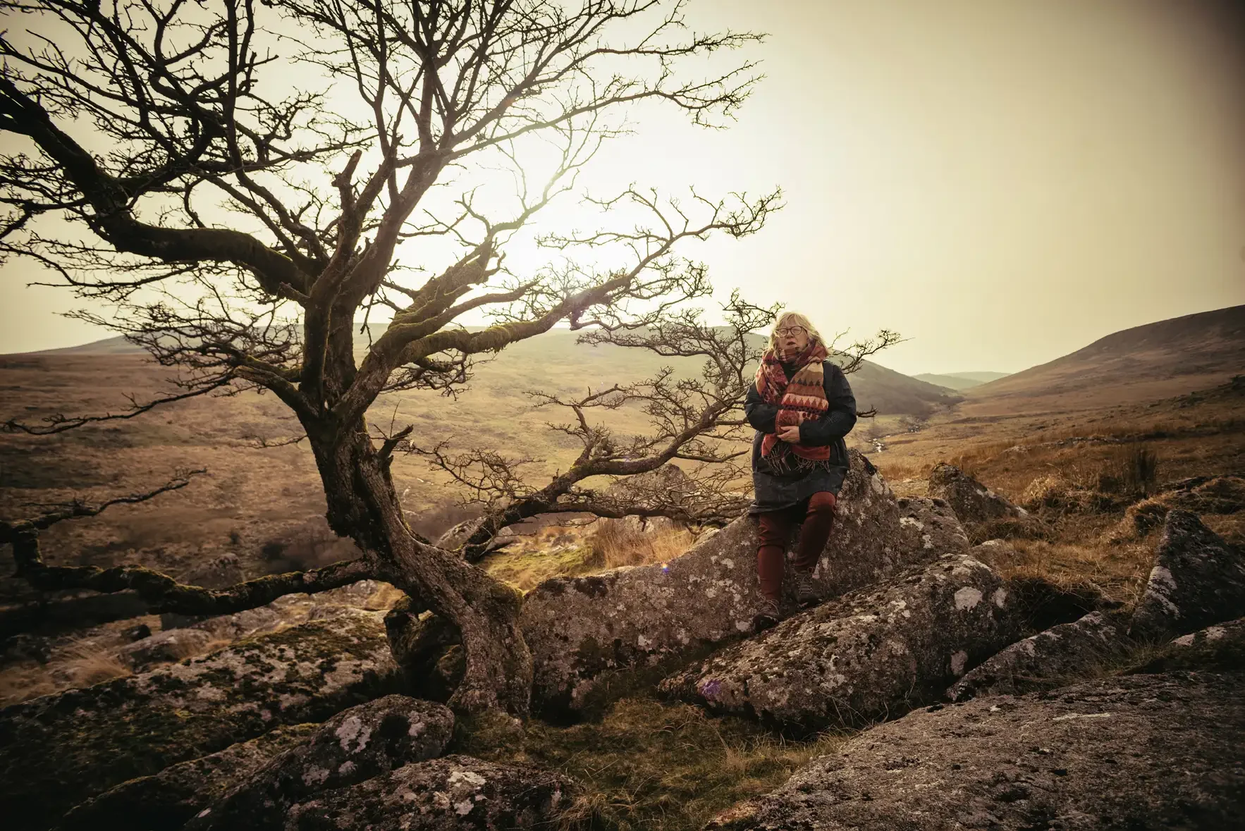 Dartmoor Portraits for Creatives - Poet, Kate Gold on the edge of Shelstone Tor