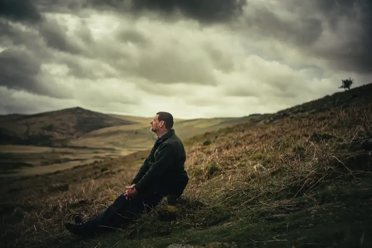 Paul Rendell aka Dartmoor Paul, author, guide and editor of The Dartmoor News, sat overlooking Taw Marsh, near Belstone