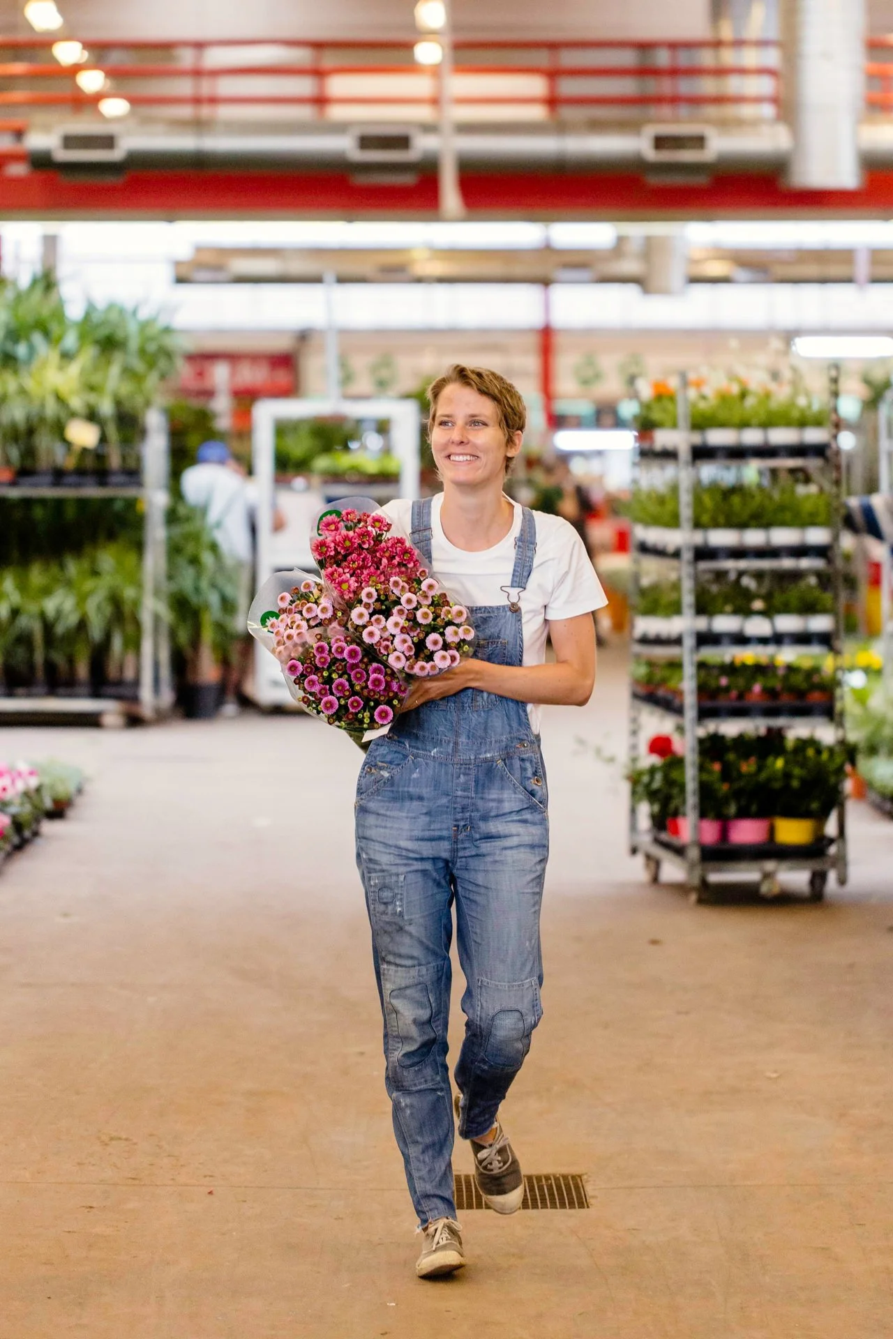 Margaux Bastid, floral designer, sourcing flowers at the Barcelona local market for international luxury events