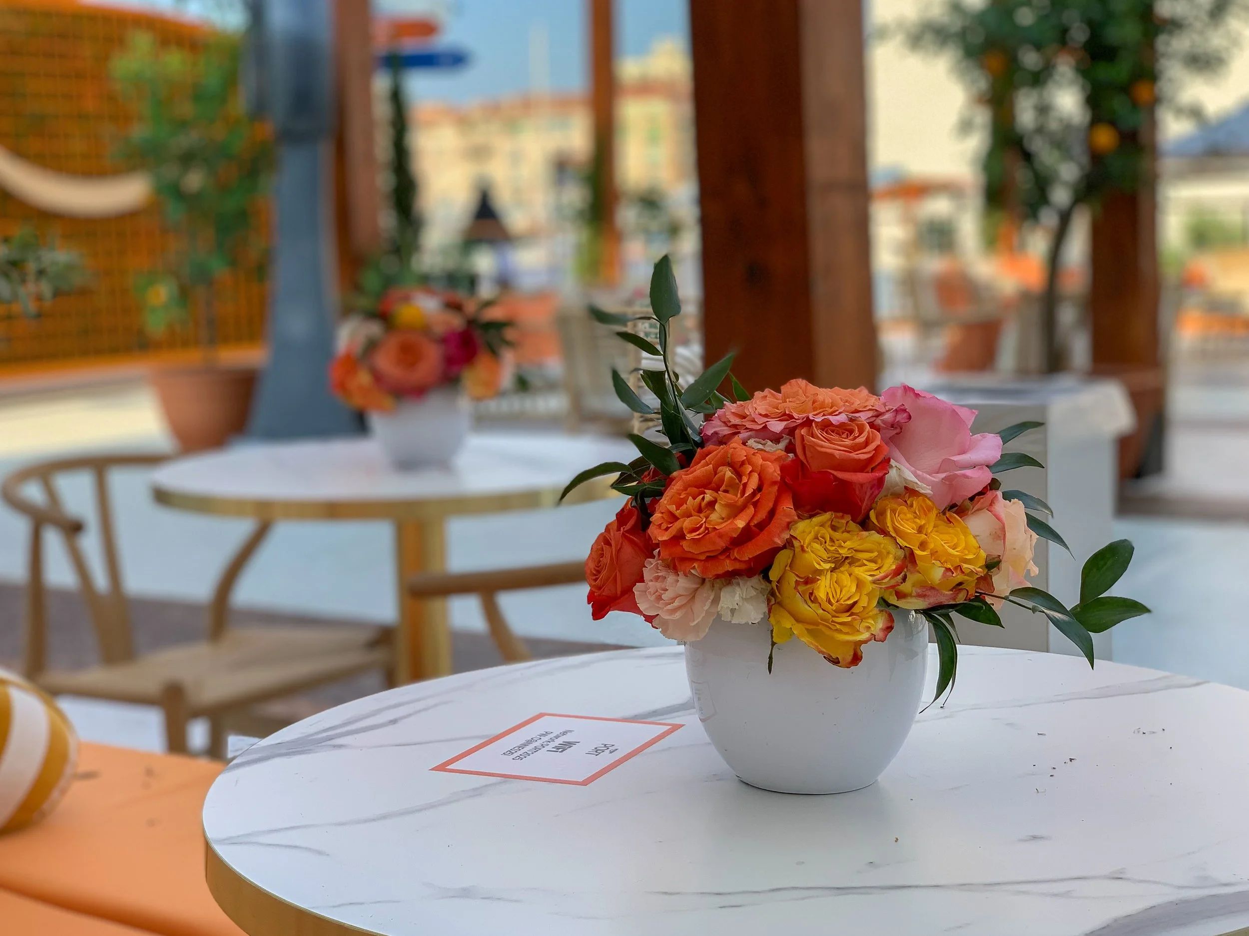 Mosaicflowers intimate floral composition in pink, orange, and yellow hues for Amazon international brand activation at Cannes Lions Festival 2025