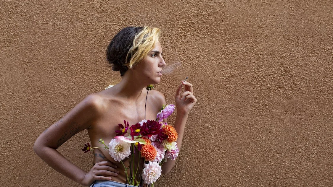 Woman holding fresh bouquet styled by Mosaic Flowers in editorial photoshoot Barcelona
