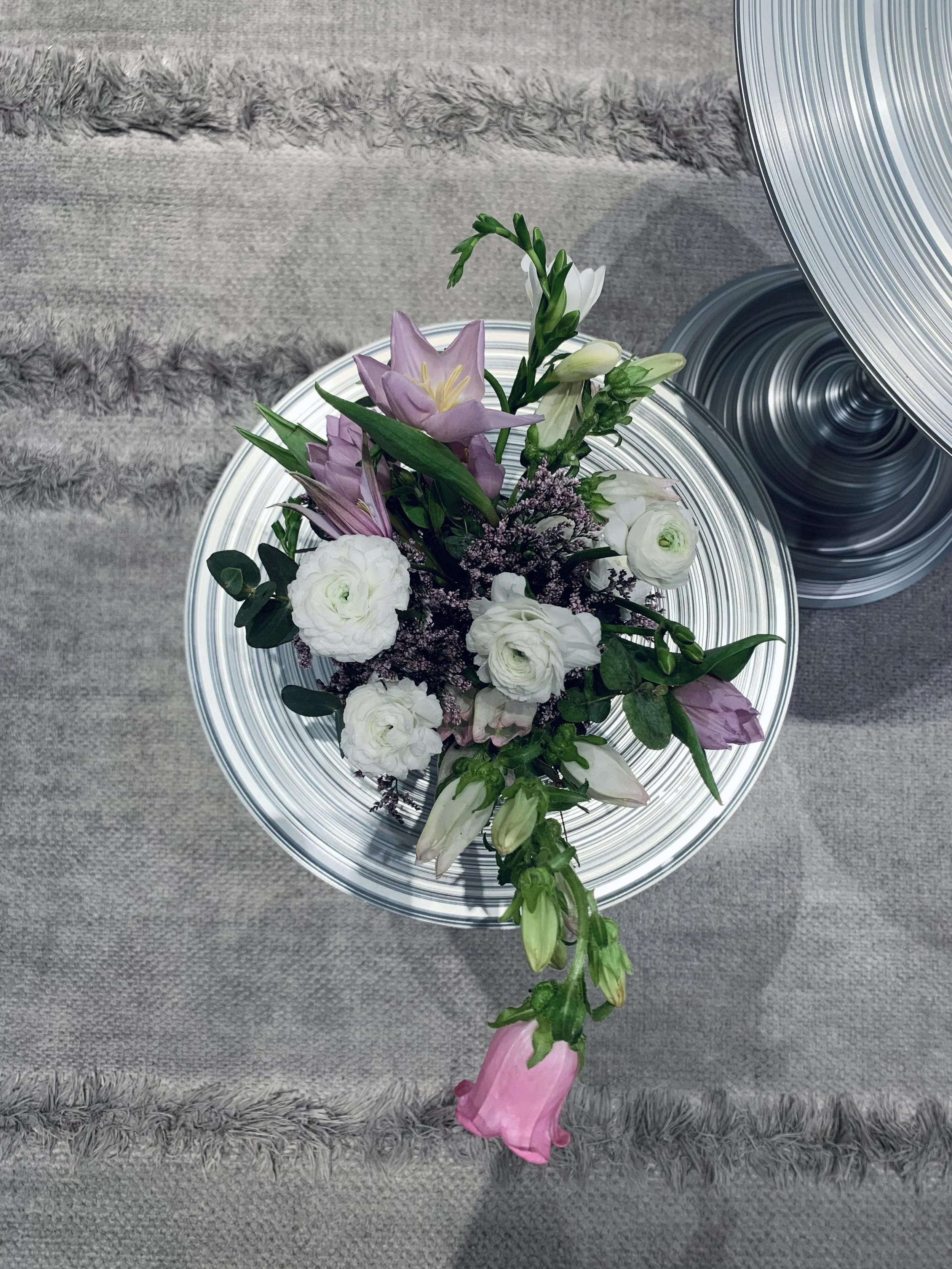 Margaux from Mosaic Flowers arranging an elegant display for Dior’s Spring 24 Collection