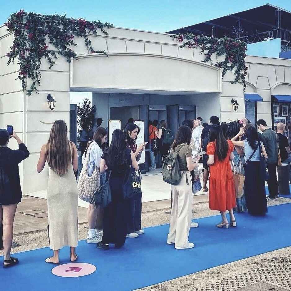 Floral entrance installation by Mosaic Flowers welcoming guests to a luxury international brand activation at the Cannes Lions Festival 2025, featuring lush cascading greenery and seasonal flowers framing the venue entrance