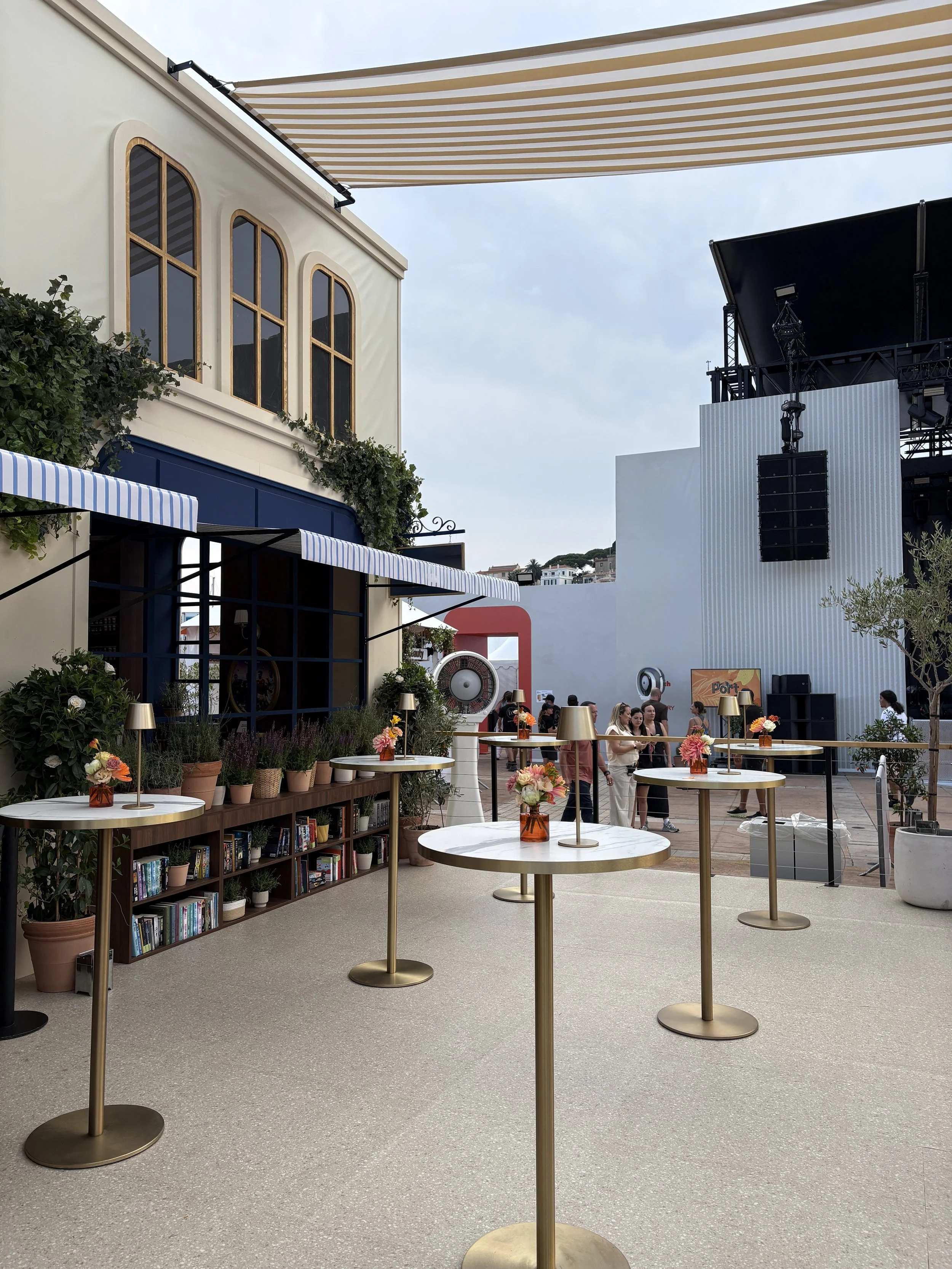 Contemporary floral installations enhancing the Amazon event space with daily refreshed luxury arrangements at Cannes Lions Festival of Creativity