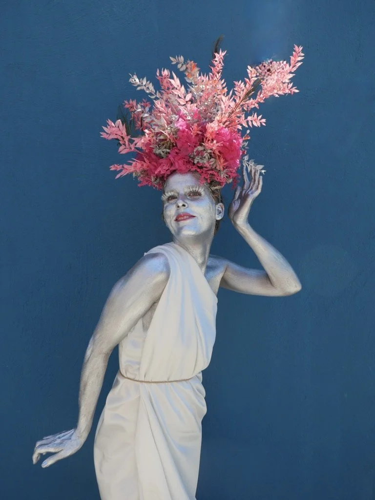 Floral art portrait with silver-painted Margaux wearing a crown of preserved flowers and a butterfly detail