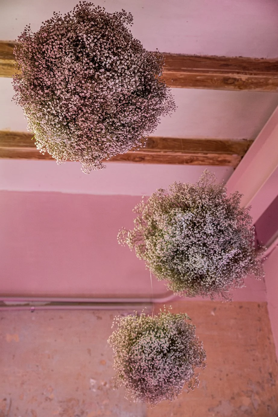 Artistic floating flower balls made with baby’s breath by Mosaic for “The Flower Experience"