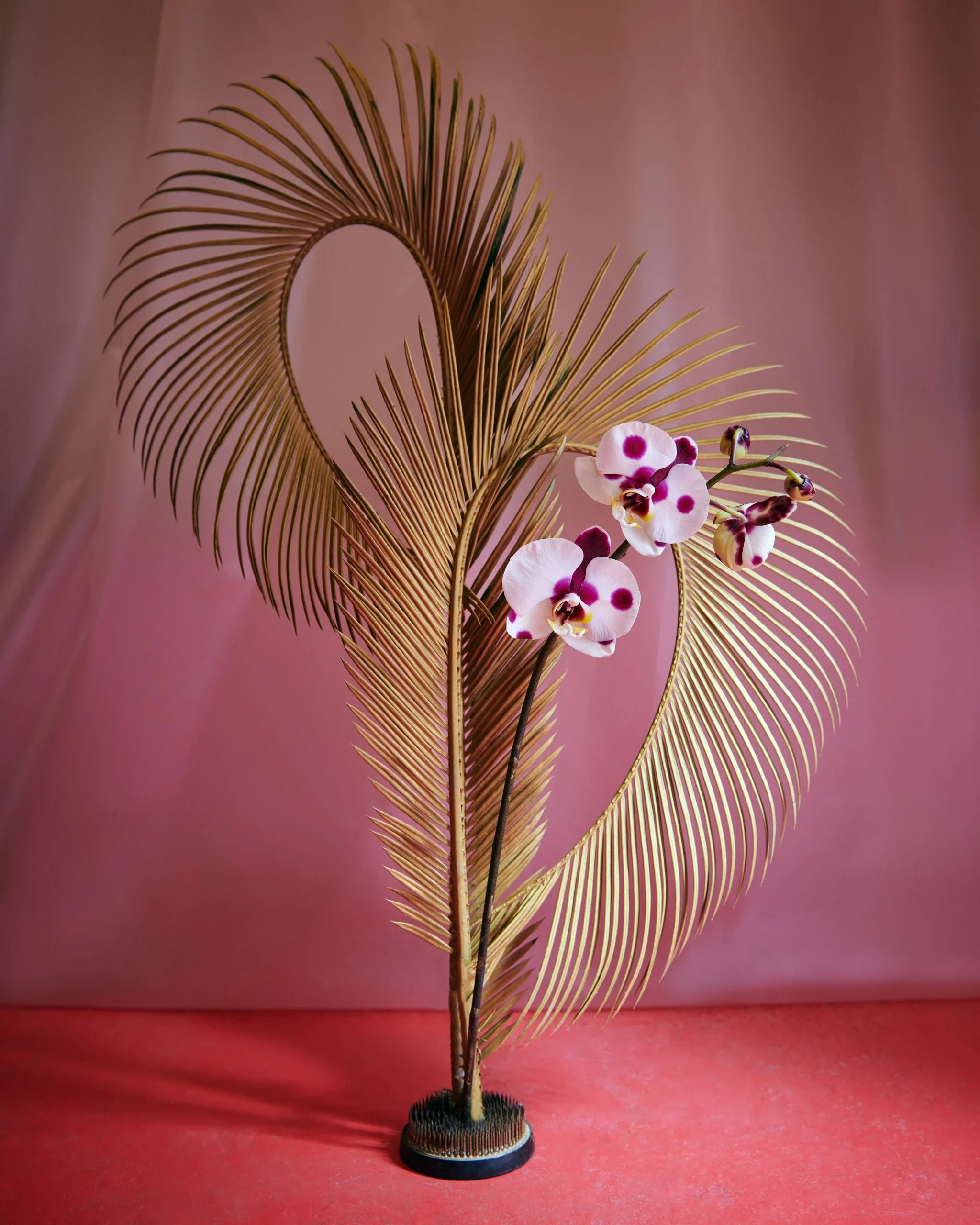 Hand-painted anthurium arranged in pink bottles, part of Mosaic’s artistic floral installation in Barcelona