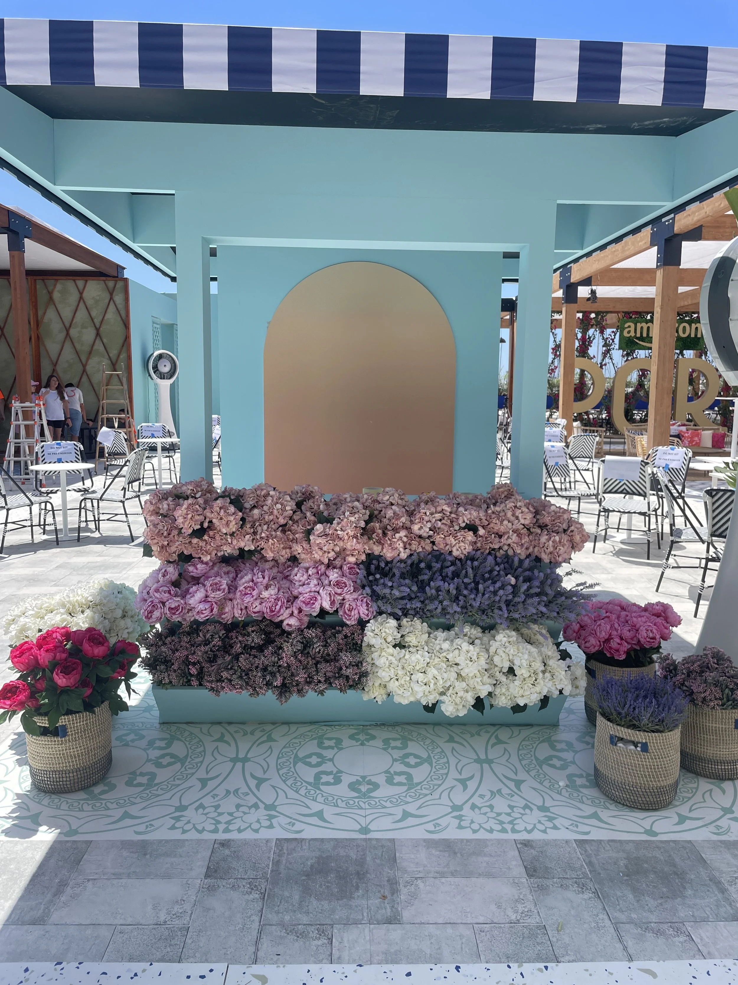 Bespoke floral entrance installation by Mosaic Flowers for Cannes Lions Festival 2025, featuring abundant hydrangeas and premium seasonal flowers for a luxury international brand activation