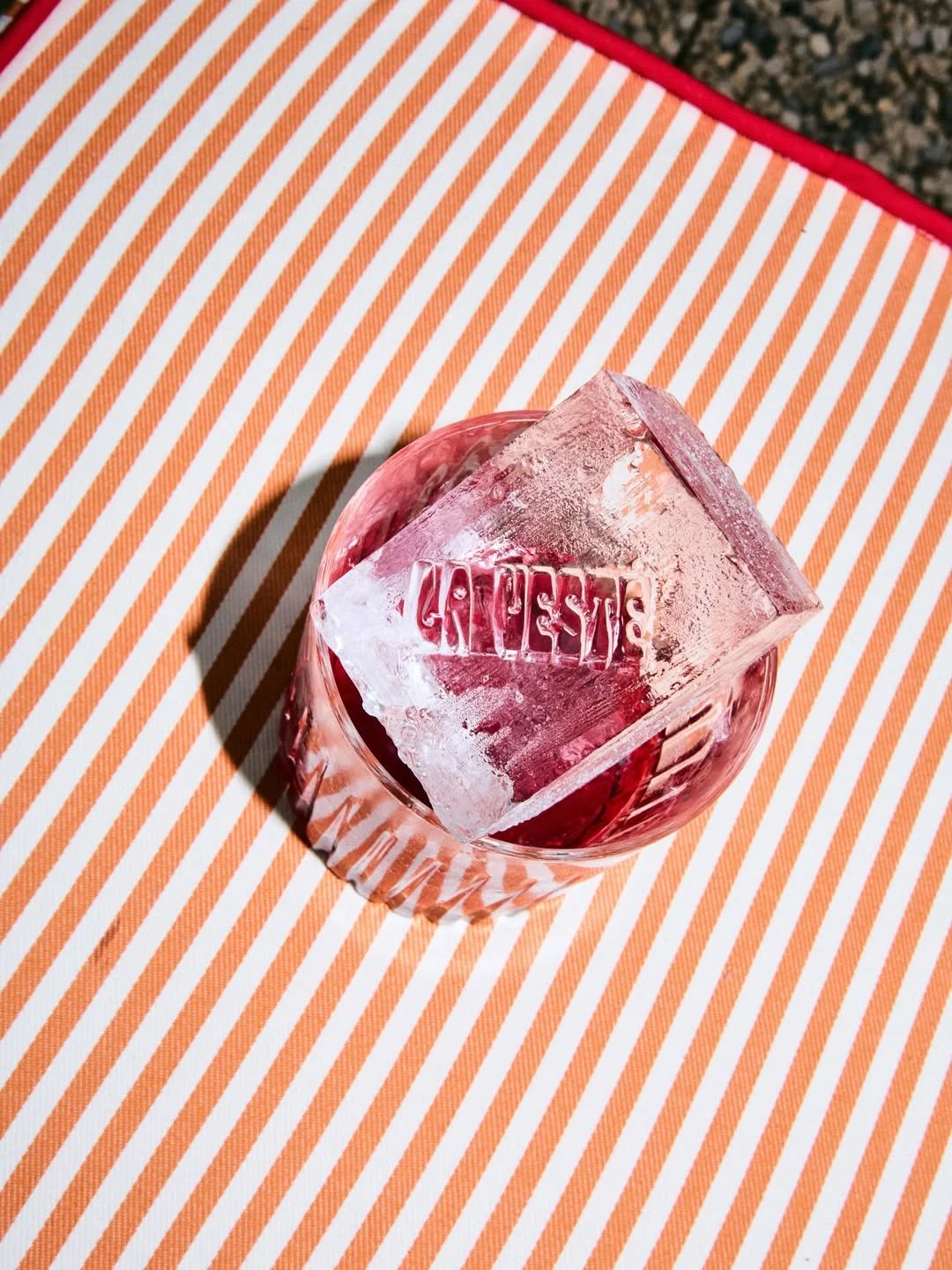 Branded event detail celebrating the exclusive La Veste × Ivine Paris sticker collaboration, styled with colorful floral elements and playful luxury aesthetics
