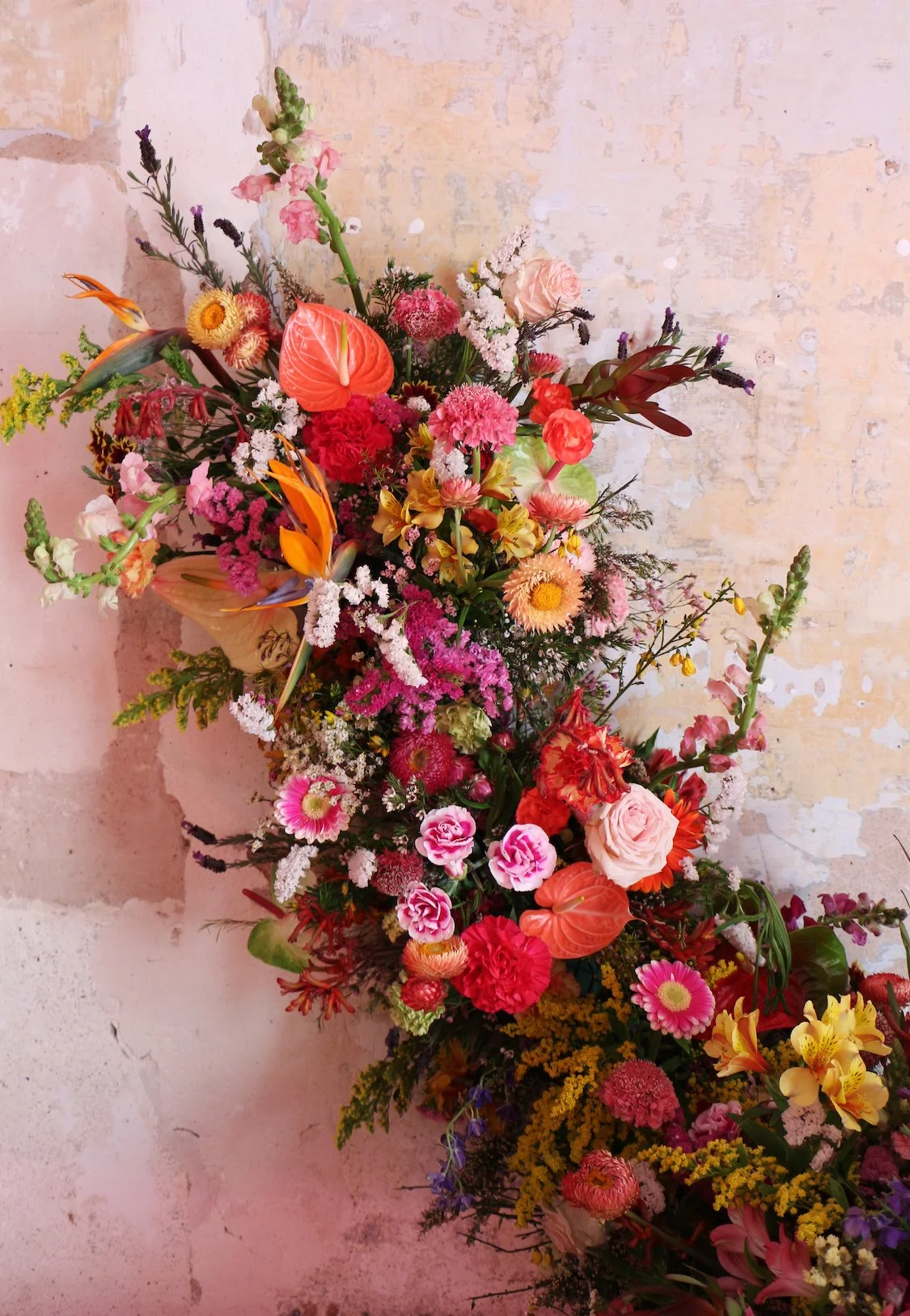 Climbing floral structure covered with vibrant blooms at Mosaic’s “The Flower Experience"