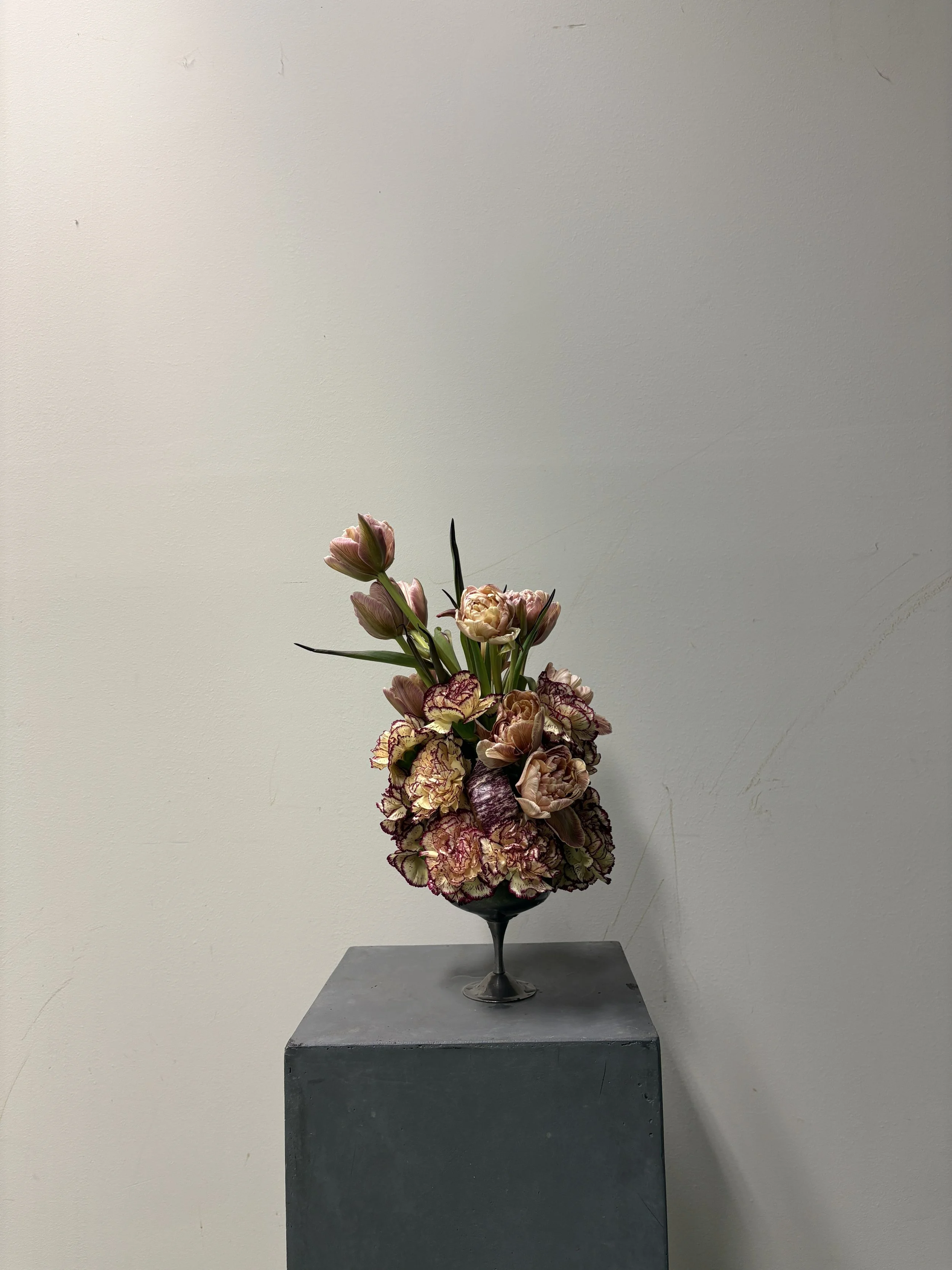 Contemporary sculptural floral arrangement designed for Christie and Andrew's luxury wedding celebration at Villa Almanita in Catalunya