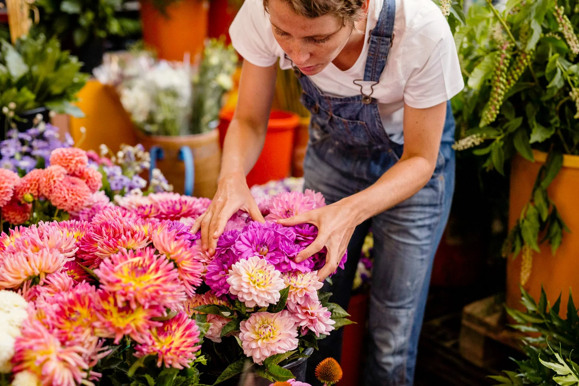Floral designer Margaux Bastid talking with horticulturists at the Barcelona local market, sourcing flowers for luxury events