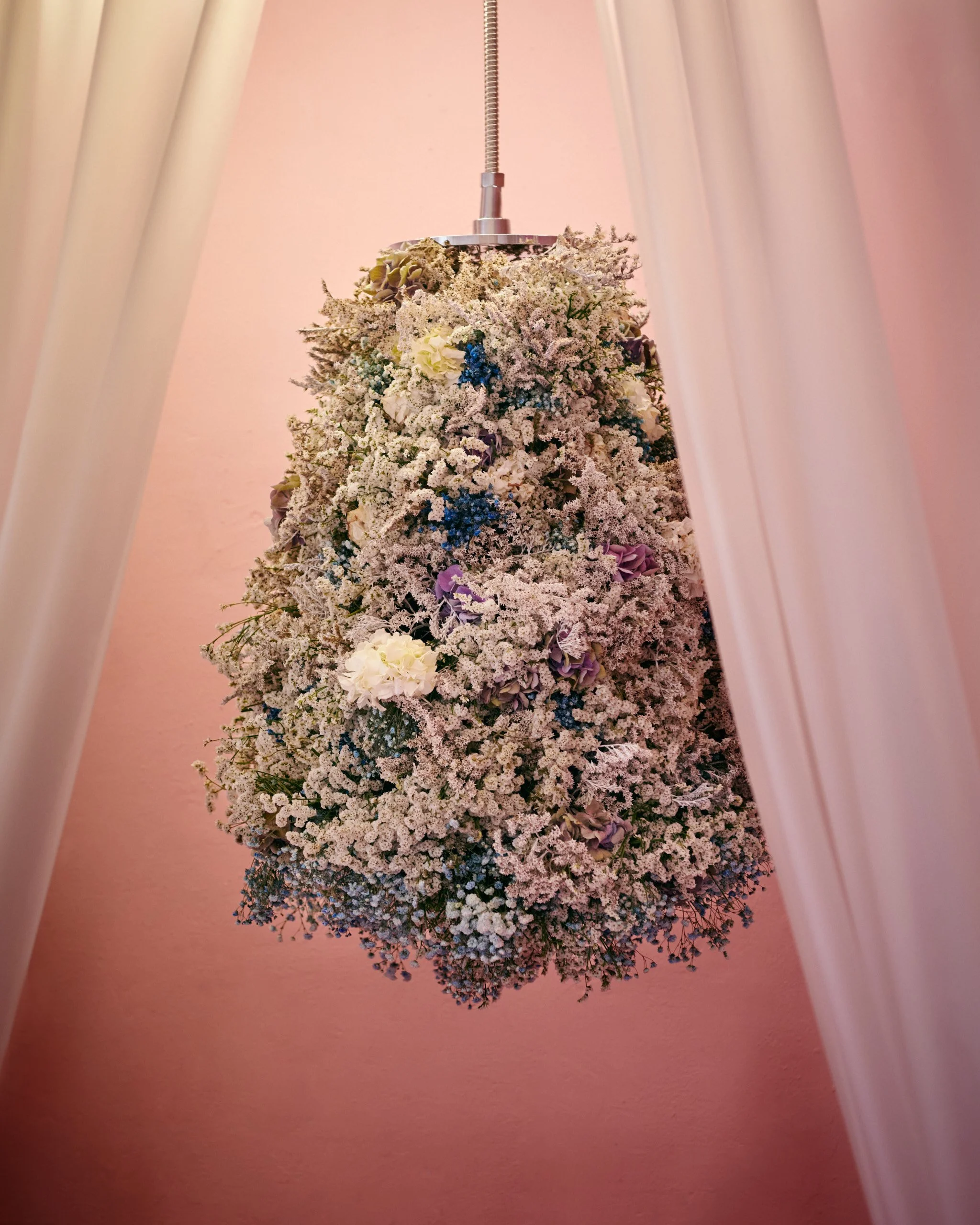 Dramatic floral shower installation by Mosaic, part of The Bathroom exhibition exploring new uses of flowers