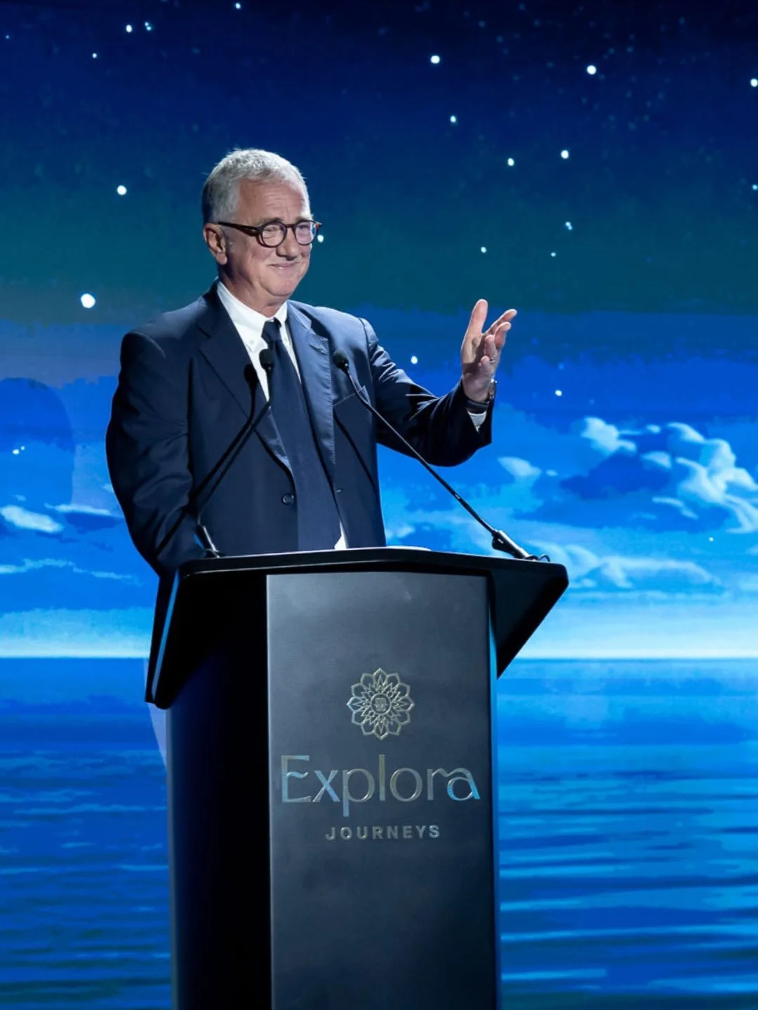 Executive delivering a speech during the Explora III inauguration with premium event staging