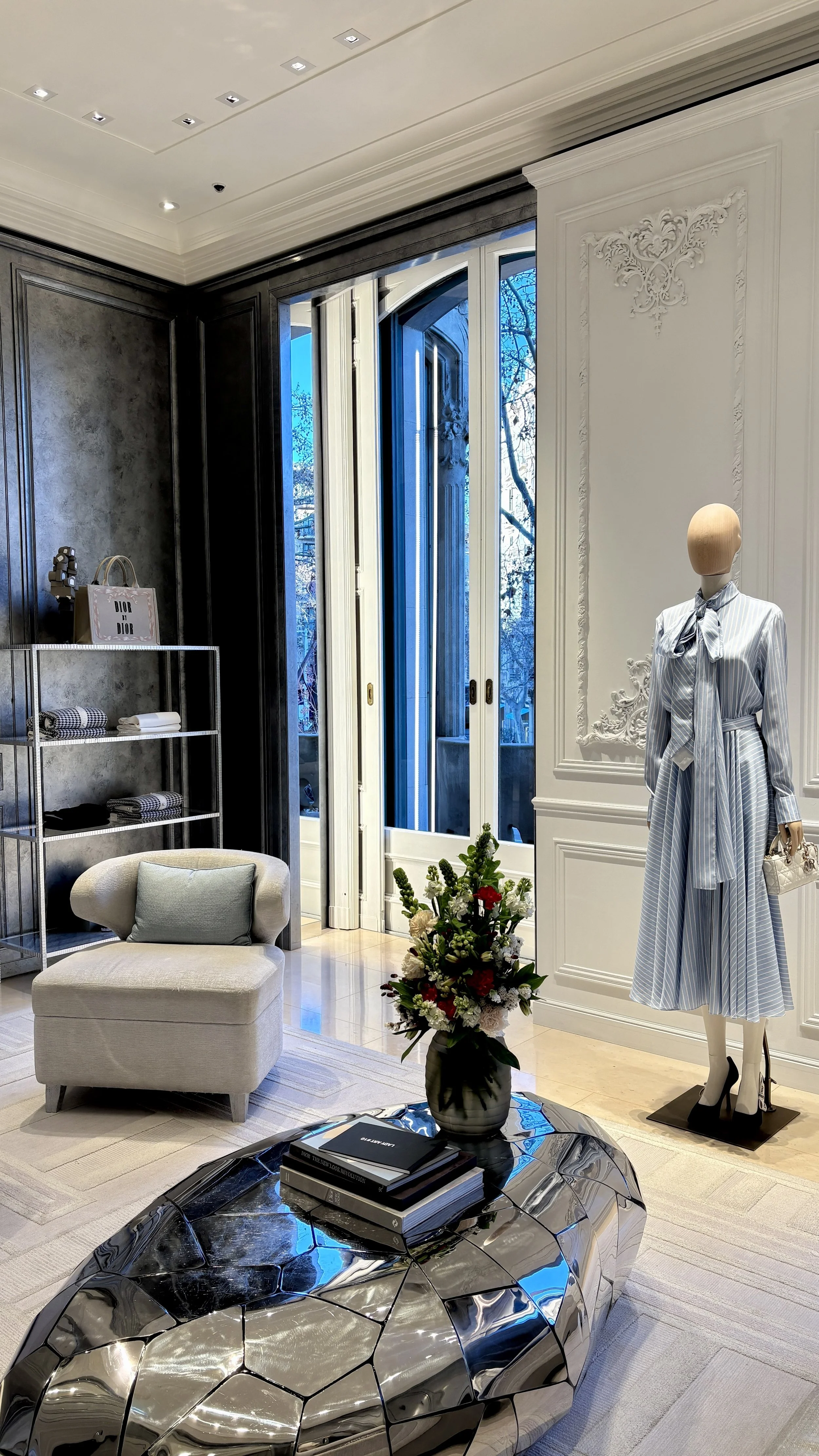 Artistic floral installation enhancing the interior of a luxury fashion flagship store in Barcelona for the Spring Summer 2027 collection