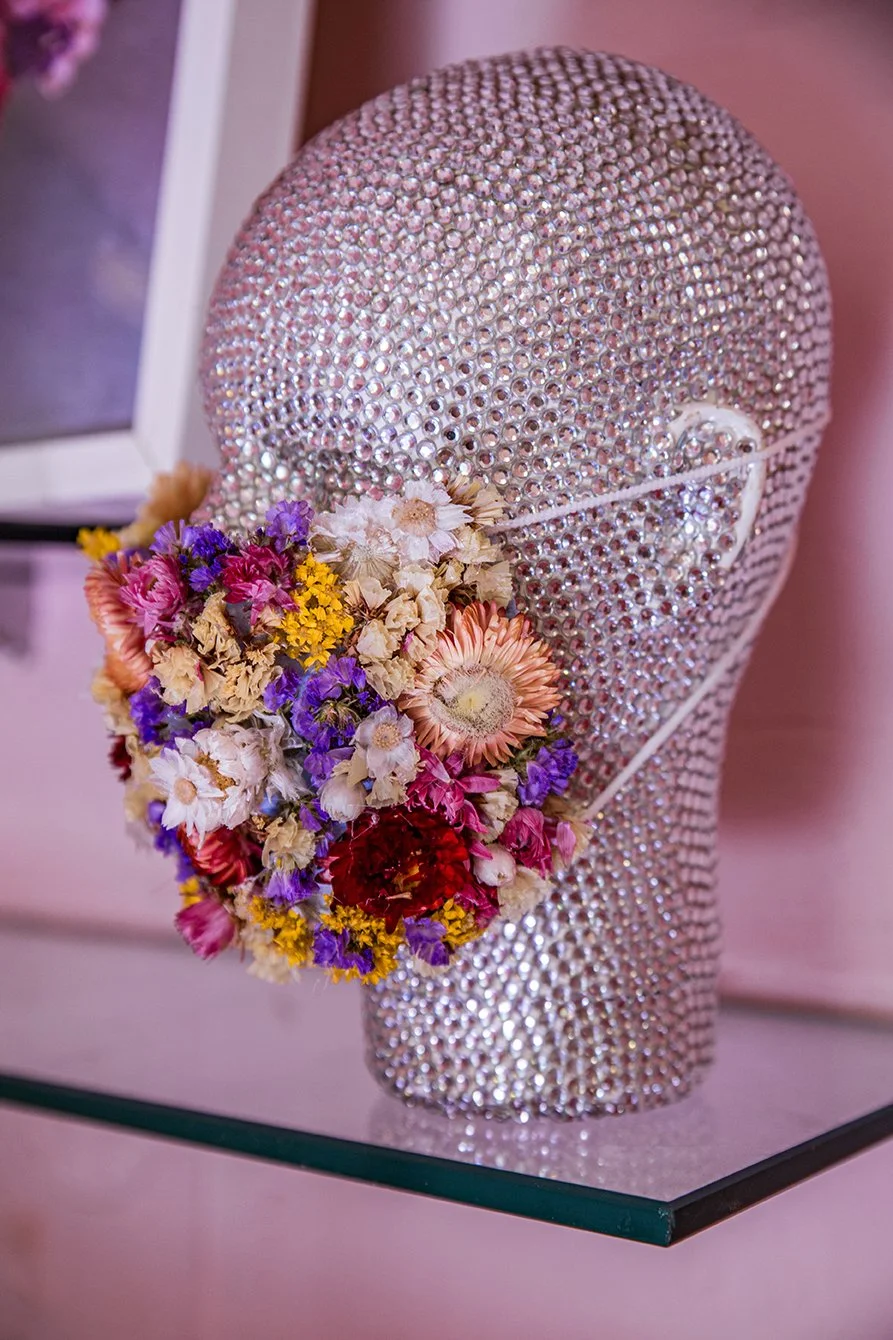 Creative COVID mask made of colorful dried flowers by Mosaic at “The Flower Experience"