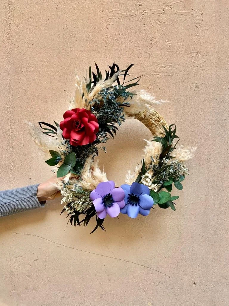 Handmade festive wreath with dried preserved and paper flowers styled by Mosaic Flowers Barcelona