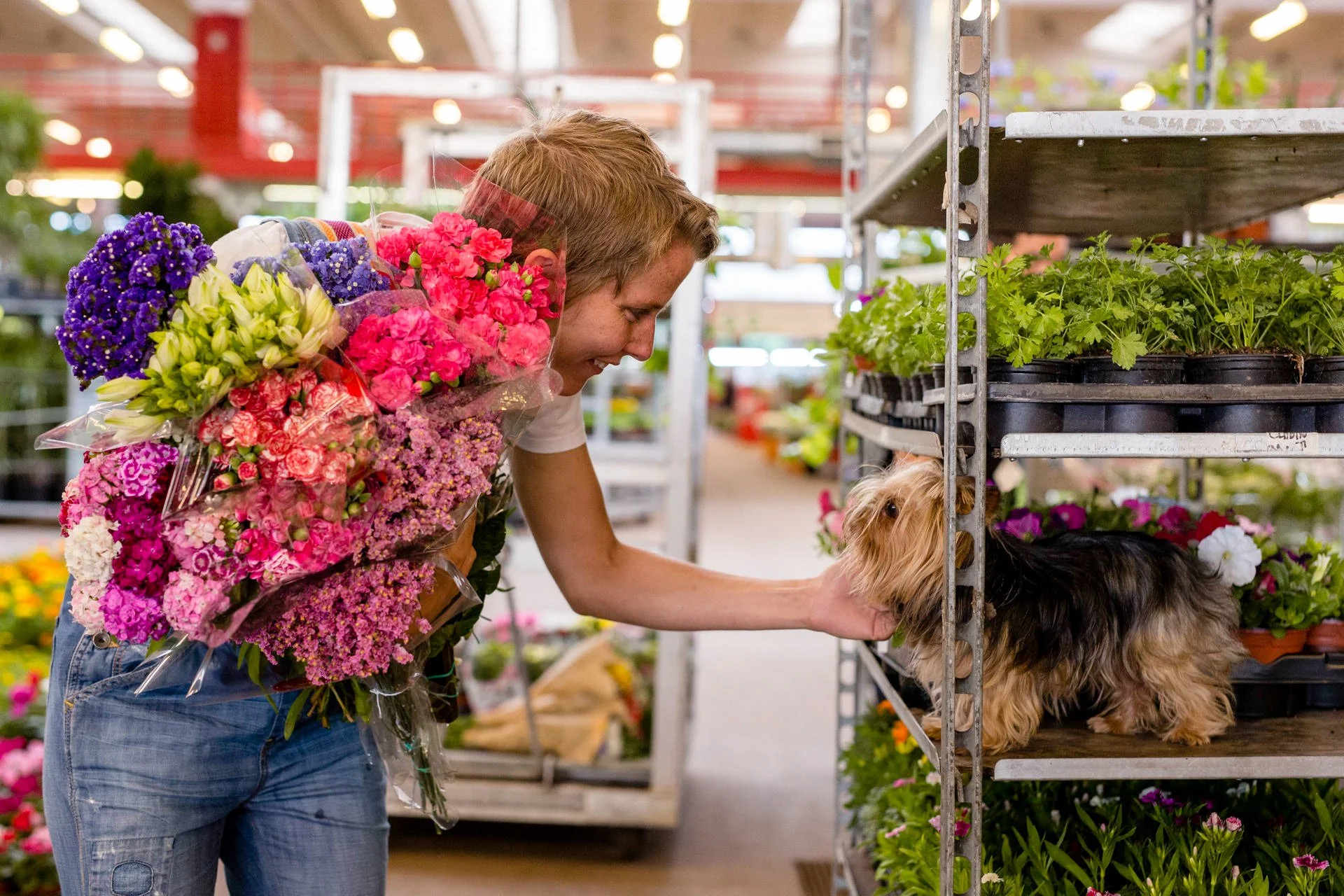 Floral designer walking with seasonal flowers in the Barcelona market, Mosaic Flowers creating luxury event designs