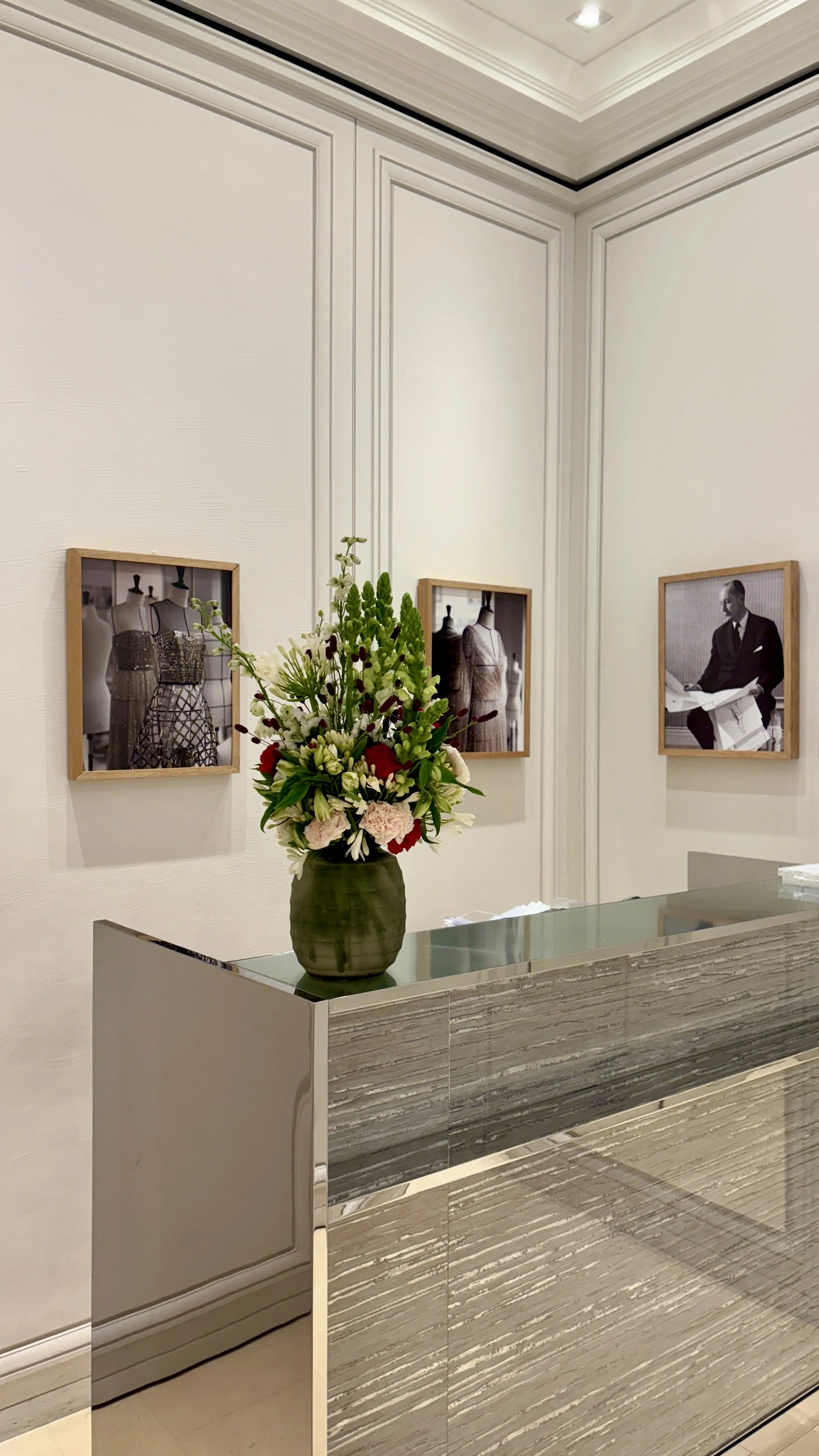 Luxury floral centrepiece placed in the main showroom of a Barcelona flagship store during the Spring Summer 2027 collection
