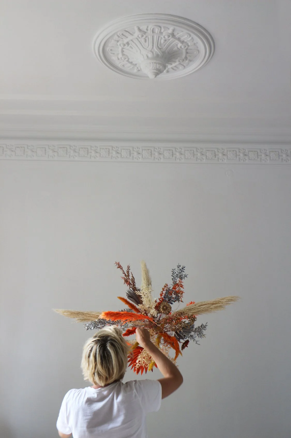 Behind the scenes with floral artist Margaux of Mosaic working on a bespoke ceiling installation for luxury interiors in Barcelona