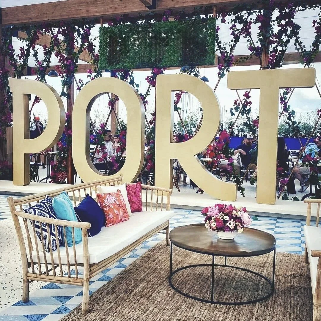 Elegant lounge styling by Mosaic Flowers at Cannes Lions Festival 2025 with a handcrafted floral centrepiece created for an international luxury brand hospitality space